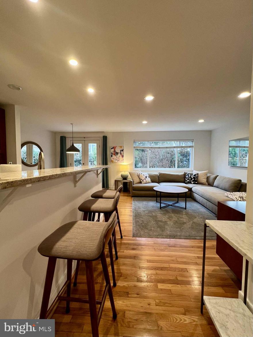 Welcome to a bright, comfortable two-bedroom home in one of Arlington’s most charming and convenient neighborhoods. This renovated middle-floor residence occupies the entire level of a purpose-built duplex, offering privacy, separate utilities, and approximately 1,000 square feet of well-designed living space. Hardwood floors run throughout, leading into an open kitchen with stainless steel appliances and a welcoming living area ideal for everyday living or working from home.


Step outside to a spacious patio with a large table and comfortable seating, perfect for outdoor meals or relaxing evenings. Enjoy high-speed internet, smart TVs, ample storage, and access to a washer and dryer. Located just a short drive to Washington, D.C., with reliable public transportation nearby, and minutes from Safeway, Harris Teeter, Trader Joe’s, Whole Foods, coffee shops, pharmacies, and local dining. Set in a quiet, safe Arlington neighborhood. Smoke-free property. Exterior security lighting and cameras in common areas only.