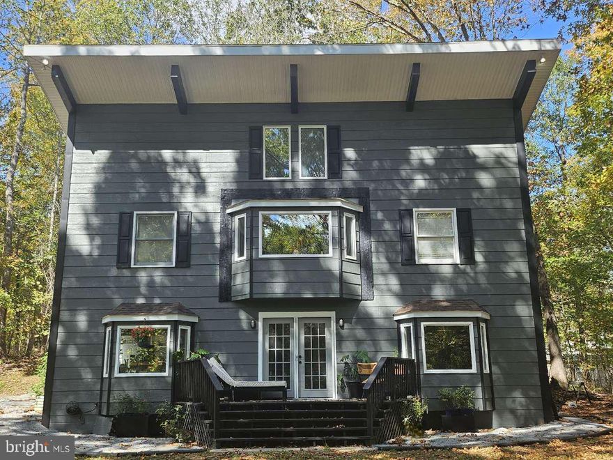 A natural sanctuary to play, relax and make memories.
Enjoy nature while being close to town! On almost 3 acres of beautiful wooded land with spring
fed babbling brooks to delight the senses and clear areas for gardens, you can grow food just
outside your door.
Step inside this beautiful 3 bedroom Salt Box style home to discover a warm and inviting interior
that seemslessly blends open and airy with a cozy and calm main livingspace. Rustic and old
world inspired while still modern and sophisticated, this purposefully designed home boasts
architectural details like hardwood floors, wooden beams, brickwork and natural stone counters.
Energy efficient passive solar design synergizes with the mature shade trees supplementing
cooling in the summer and heating in the winter
The whole home is spacious and welcoming, providing ample room for relaxation and
entertaining. The kitchen features updated cabinetry, and all new appliances with an adorable
pantry and large island. With a large yard and 2 decks you are spoiled for choice when it comes
to space to host gatherings for family and friends.
Updated Laundry Room and generous closet space allows pleasant to meet practical in the best
ways.
Fast and reliable gigabit capable fiber internet for your WFH, Smarthome and entertainment
needs.
On the upper level, a light filled bonus space with vaulted ceiling and great windows offers so
many possibilities. Don't settle for cookie cutter or builder basic when you can have cool and
special.