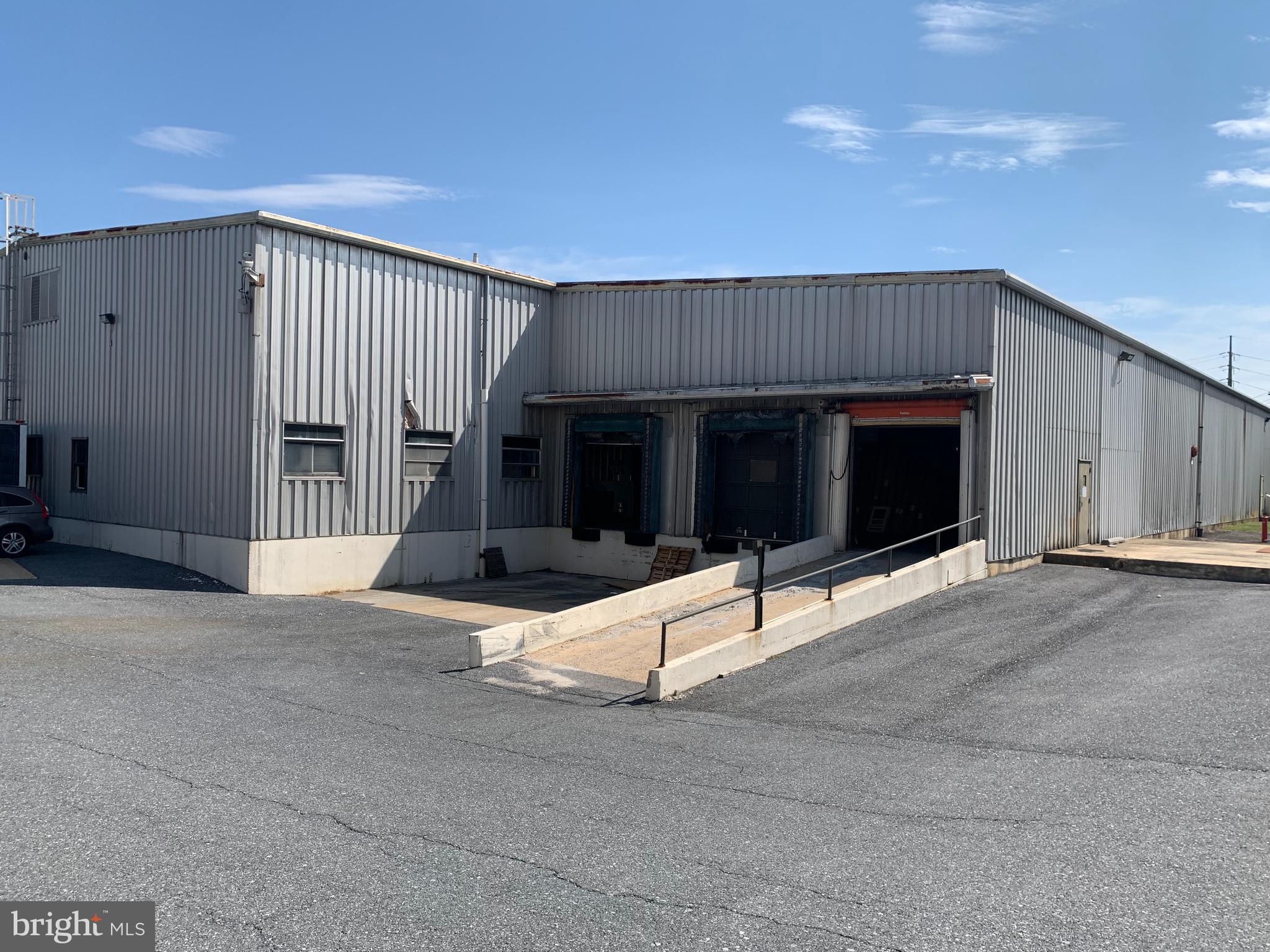 Building 14 is located on the south side of Burle Corporate Park, is a standalone warehouse offering the unique feature of cross-dock access, allowing tenants to receive deliveries on one side of the building and ship from the opposite side. The building includes 8 truck docks and 1 grade-level door for drive-in accessibility. Spanning 41,313 square feet, with approximately 1,000 square feet of office space, it offers ample functional space. The ceilings are approximately 16 feet high at the soffit and 22 feet at the center, providing flexibility for a variety of uses. Additionally, there is parking available for trucks, trailers, and employees, and the location is less than 1 mile from Route 30. The asking rate for the space is $7.00 NNN.