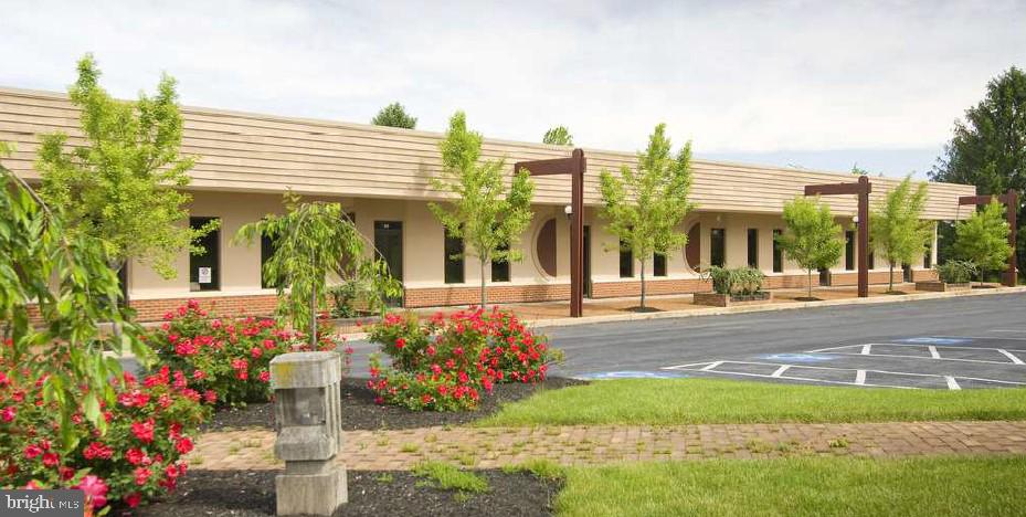 Office space with a reception area, conference room and two offices.