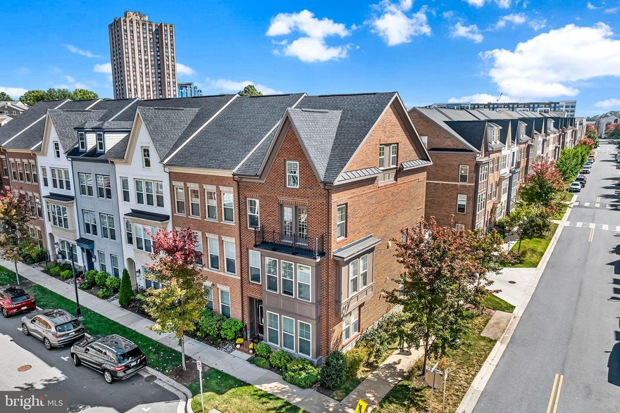 NEW carpet-Please remove shoes, or wear shoe coverings. Welcome to this exceptional 4-bedroom end-unit townhome, perfectly situated in one of the most desirable locations in Downtown Crown. Just one street away from shops and restaurants, you’ll enjoy the convenience of walking to everything you need, while still tucked away in a quiet and private setting. With unmatched light, stunning views, and a vibrant community at your doorstep, this home blends style, comfort, and walkability.
Bathed in sunlight from its eastern, southern, and western exposures, the home’s abundant windows showcase park views, tree-lined streets, and beautiful sunsets.
On the entry level, a spacious foyer with a coat closet leads to a versatile office, accessible directly from both the front door and the attached two-car garage. New upgraded carpet has been installed in the office and a runner on the stairs.
The main level is designed for entertaining, featuring an open layout with wood floors throughout. The kitchen boasts a large granite island with seating, brand-new upgraded appliances including a 5-burner gas stove and counter-depth refrigerator. The generous dining area easily accommodates a large table, and extends seamlessly to a deck—perfect for grilling or outdoor dining. The light and roomy living room is comfortable and elegant. A stylish powder room completes this level.
Upstairs, the primary suite offers a walk-in custom closet and a spa-like en-suite bathroom with dual vanities and a dual-shower-head shower. Conveniently located nearby, the laundry room includes a side-by-side washer and dryer. Two additional bedrooms with brand-new carpet share a hall bath with a tub.
The top floor provides even more flexibility with a fourth bedroom—or a multipurpose space ideal for a family room, office, or guest suite—complete with its own private balcony, a full bathroom, and a large built-in storage area.
With its spacious floor plan, luxury finishes, this freshly painted end-unit home is in unbeatable location, and is a rare find in Crown Farm. 
A really great location; steps to Downtown Crown, a couple of blocks to the lake at the Rio, and walkable to the new Crown High School. The community offers an outdoor swimming pool, rock climbing area, tennis court and a work hours community shuttle service every 30 minutes to Shady Grove Metro. A Fitness center, cafes, and restaurants are all nearby, with Downtown Crown  and Rio just blocks away. Easy access to I-270 for a convenient commute. This home is perfect for those seeking convenience, and a vibrant community. Don’t miss the chance to make it yours!