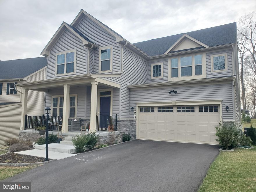 Welcome to 6979 Mandalong Way, a beautifully designed 5-bedroom, 4-bathroom home in the sought-after Lake Linganore community of New Market, MD. Given the newness of the home, it is in immaculate condition. As you approach, you are greeted by a welcoming front porch and excellent curb appeal. This less-than-two-year-old home offers approximately 3,800 square feet of living space, providing ample room for comfortable living and entertaining.

As you enter, you are welcomed by a gorgeous entryway, a bedroom and full bath on the main floor, and a flex space that can be used as a playroom, library, or office area. The main level boasts an open-concept design, filled with natural light. The gourmet kitchen features stainless steel appliances, granite countertops, a large island, and plenty of cabinet space and a large pantry. The adjoining dining and living areas create a seamless flow, perfect for hosting guests or relaxing with family.

On the upper level, there are 4 additional bedrooms, 3 additional full bathrooms, and a lovely spacious loft area. The expansive master bedroom offers two walk-in closets and a luxurious ensuite bathroom. The additional bedrooms provide ample space for family, guests, or a home office.

Please note that the basement is not included in the rental. The owners will be keeping items stored in the basement, and access will not be available to tenants.

The property is available to rent fully furnished for $4,800 per month, offering a turnkey living experience for those looking for a hassle-free move.

This home also features a spacious two-car garage, providing plenty of room for parking and additional storage.

Outside, the large, open backyard provides plenty of space to enjoy the outdoors. Enjoy all the Lake Linganore amenities and experience the lake living lifestyle! Whether it's kayaking, fishing, hiking, or simply lounging with your feet in the sand on the private beaches. Take a dip in one of the four pools or plan a gathering at one of the clubhouses. Partner up on the tennis courts, play a game of hoops, or explore the miles and miles of scenic nature trails.

This home is in close proximity to Oakdale High School, the new Blue Heron Elementary School, and major commuter routes like I-70 and R-15. Enjoy easy access to downtown New Market and downtown Frederick, making this location perfect for those seeking both convenience and a peaceful suburban lifestyle.

Please note, a 650 minimum credit score is required per adult. A 12-month minimum lease term is also required. Contact us today to schedule a showing!