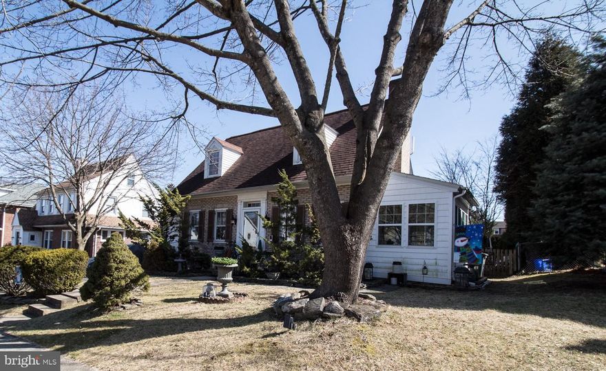 Welcome to this charming home on a pretty tree lined street! This property has eye-catching  curb appeal and offers the perfect blend of comfort and style! It is full of character with its arched doorways, stunning hardwood floors, crown molding and wood burning fireplace. The inviting sunroom is the perfect spot to sip your morning coffee or enjoy your favorite book. Relax and unwind on the beautiful patio, perfect for hosting gatherings and family fun. The backyard has a raised garden bed and offers plenty of room for outdoor activities. There is also an attached shed/storage area and a detached shed for extra storage to keep the convenient single car garage clutter free. The lower level has a large family room, convenient half bath and laundry area. Upstairs there is newer carpeting in all the bedrooms. There are two big bedrooms and a smaller third bedroom which would be perfect for a nursery or home office. Built ins in the bedrooms add additional charm to this beautiful home.