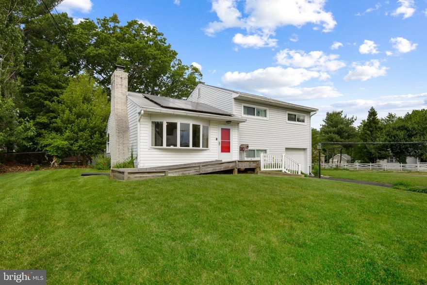 WOW!   Investor /  DIY Alert!! Here's your opportunity to own a SFH with a huge corner lot in Harford County! This home already has the unique features and charm! It's just waiting for your finishing touch! As you walk up the paved driveway you will notice you have the option to use the ramp or stair walkway.  Or use the attached garage on those rainy days! Open the door and you will find an "Open Concept" floor plan. The Living Room boasts a huge fireplace, a spectacular vaulted wood beam ceiling and a bay window! This quaint Kitchen includes a Gas Stove! Open the sliding doors and rest on the updated deck with retractable awning which looks out at the expansive fully fenced rear yard! Upstairs you will find 3 Bedrooms, 1 Full Bath and a linen closet in the Hallway! The Primary Bedroom also features those unique wood beam ceiling and it's very own private deck! Upstairs Bedrooms all have wood floors under the carpeting! Downstairs includes a finished area with so many possible uses! It could be used as a den/family room/play area/office/etc! The Unfinished basement features plenty of storage space, washer/dryer, access door to the level rear yard patio and access door to the Garage. Garage is currently setup as a workshop, but could be easily converted back into a garage. Shed & interior chair lift convey! Fully fenced rear yard! Commuter Friendly! Close prox. to I-95, APG, Shopping, Restaurants, and Iron Bird Stadium! Solar Panels Leased. Property being conveyed "As-Is". Don't Miss Out! Call today to schedule your showing! Offer Deadline Sunday @ 9pm