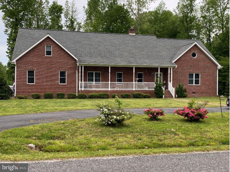 This gorgeous 2 level brick classic home, which is located 1 block  from the Potomac River on a DOUBLE LOT equaling over half an acre, with a THREE CAR GARAGE AND TWO FIRST FLOOR BEDROOMS... will be going active very soon. On the main floor, which has been freshly painted, you have a primary bedroom that includes a large walk in closet, and a luxury master bathroom complete with a soaker tub, a tiled walk in shower, and double sink vanity!  Then you have the second first floor bedroom that could also be used as an office. Then the kitchen, with its cabinets to the ceiling, granite countertops a full stainless steal appliance package including a fridge, double wall oven, cook-top and dishwasher with its over hang for stools which opens up to your family room where you must cozy up to your gas fireplace and enjoy all that this home has to offer. Then the large dining area and massive living room, perfect for entertaining. Then head upstairs where there is an additional 5 more rooms and tons and tons of storage.. 3 bedrooms, an office, and a gaming or craft room, plus another full bathroom. TONS of space to spread out and make each space its own oasis.  Recent changes have included replacing an outdoor HVAC unit and adding a fire pit and landscaping to the back and side yards. You will never need for storage space with the 3 car over sized garage, plus a shed that stays with the home and there is plenty of parking spaces with TWO driveways on this gorgeous corner lot in Westmoreland Shores (NO HOA) LOCATION is key with this property being only 20 minutes to Dahlgren, a quick drive to LaPlata or Waldorf,  35 min to Fredericksburg.  Enjoy the Potomac River just 2 blocks away or drive 2 miles into the golf cart community, Town of Colonial Beach for all your dining, and shopping, coffee shops, boardwalk, and beach fun. There is always some entertainment and activities that you will not want to miss out on. ACT FAST!  This one will not last long :)