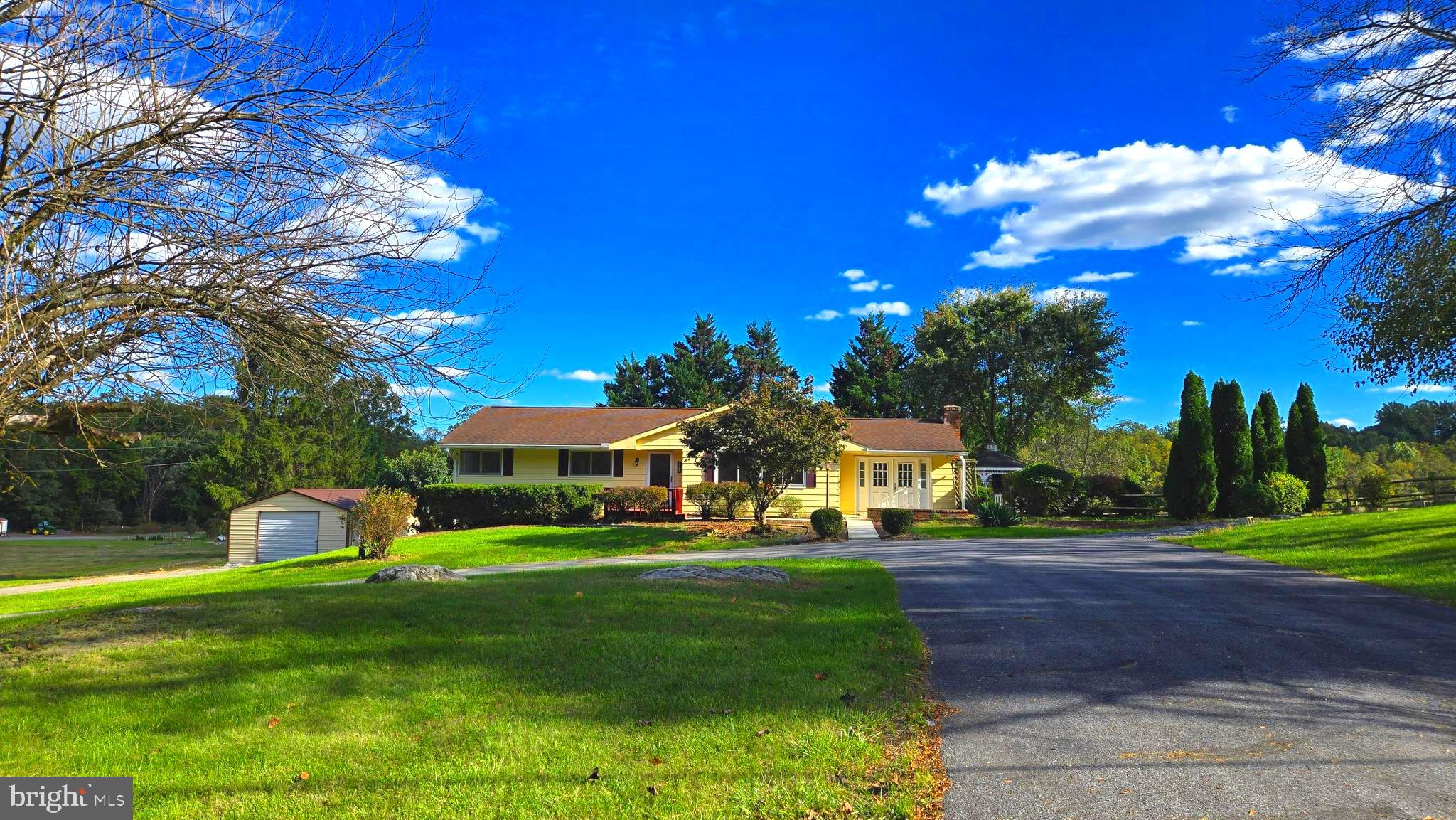 Country living just moments from modern conveniences! This deceptively large home will continue to surprise you! As you move through this home, it just seems to keep going and going. With a ground-level entry basement offering one of the five bedrooms (closet located right outside the door), one of the four full bathrooms, a kitchen area, and a living room, this home has an ideal set up for larger families and/or multi-generational living. The main floor offers 4 more bedrooms (two of which are set up as primary suites) and 3 more full bathrooms. One of the primary suites even includes its own fireplace. Outside, there is a grand circle driveway in front, as well as a metal garage building with a concrete floor that's ready for power, and a fenced in rear yard overlooking farmland. However, this home is less than five minutes from shopping, including Target, Weis, Aldi, Dick's, Ulta, HomeGoods, TJ Maxx, Royal Farms, etc. Its also equally close to I-81. All of this makes it possible to FEEL miles from civilization, but to actually BE only moments from it. No known restrictions on this 1 acre lot. Look closely, there are no other homes this size, on this large of a lot, with a similarly convenient location, for anything close to this low of a price. Make your appointment today! IF YOU LIKE WHAT YOU SEE, CALL !!!!!!!