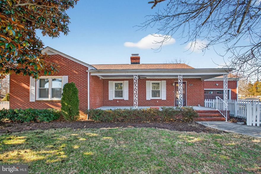 Welcome to a lovely brick home in Dahlgren—a beautifully maintained and extensively upgraded home with a water view and an unbeatable location just one block from Machodoc Creek Marina only a few minutes to the Navy Base at Dahlgren. This property offers the comfort of a well-established neighborhood paired with thoughtful modern improvements inside and out.

The home features hardwood floors and quality tile throughout, updated LED lighting, six-panel interior doors, and an efficient layout designed for easy everyday living. The kitchen has been fully refreshed with LG appliances, a 1 HP disposal, a reverse-osmosis filtration system, quiet-close raised-panel cabinetry, mixer-lift cabinet with interior outlet, a dual-level silverware drawer, stainless steel sink, Moen pull-out faucet, and Cambria Bellingham countertops extending across the kitchen, pass-through bar, and wine bar. A rolling island adds extra prep space and storage.

The living and dining areas include crown molding, a ceiling fan with LED light and remote, and a custom closet system by Schiller Enterprises. A vent-free gas fireplace with remote control adds warmth and charm. The sun porch is a standout feature, offering Thompson Creek windows, HVAC vents, carpeting, a ceiling fan with LED lighting, and a bar opening directly to the kitchen—great for entertaining.

The primary bedroom, office, and theater room each include ceiling fans with LED lights and custom closet systems. The full bathroom has been upgraded with a walk-in shower, Moen fixtures, bi-directional glass doors, linen tower, and matching vanity. The half bath features a pedestal sink. The laundry closet includes Maytag stackable units and custom shelving.

The floored and finished attic offers recessed lighting, Thompson Creek windows, and excellent storage potential.

Major systems and structural upgrades have already been taken care of:
• Carrier HVAC system (2018) with whole-house air scrubber
• Thompson Creek windows (2020)
• Dimensional roof shingles (Burnt Sienna)
• Whole-house water filtration system
• Crawl space fully insulated with new PEX water lines
• Ecobee programmable thermostat
• SimpliSafe security system with multiple cameras and motion detectors

Exterior improvements include two ProVia doors with transferable lifetime warranties, two Larson storm doors, motion-sensor lighting, a new front-porch ceiling with crown molding and venting, and SimpliSafe cameras. The deck also features upgraded doors and security.

The garage is equipped with an insulated LiftMaster door with remote and exterior keypad, attic access, and the whole-house filtration system. The property includes a 12x20 shed with a loft, four exterior water spigots, and generous open yard space for gardening, play, or outdoor projects.

The paved driveway extends to the back yard with parking spaces for your RV or boat.