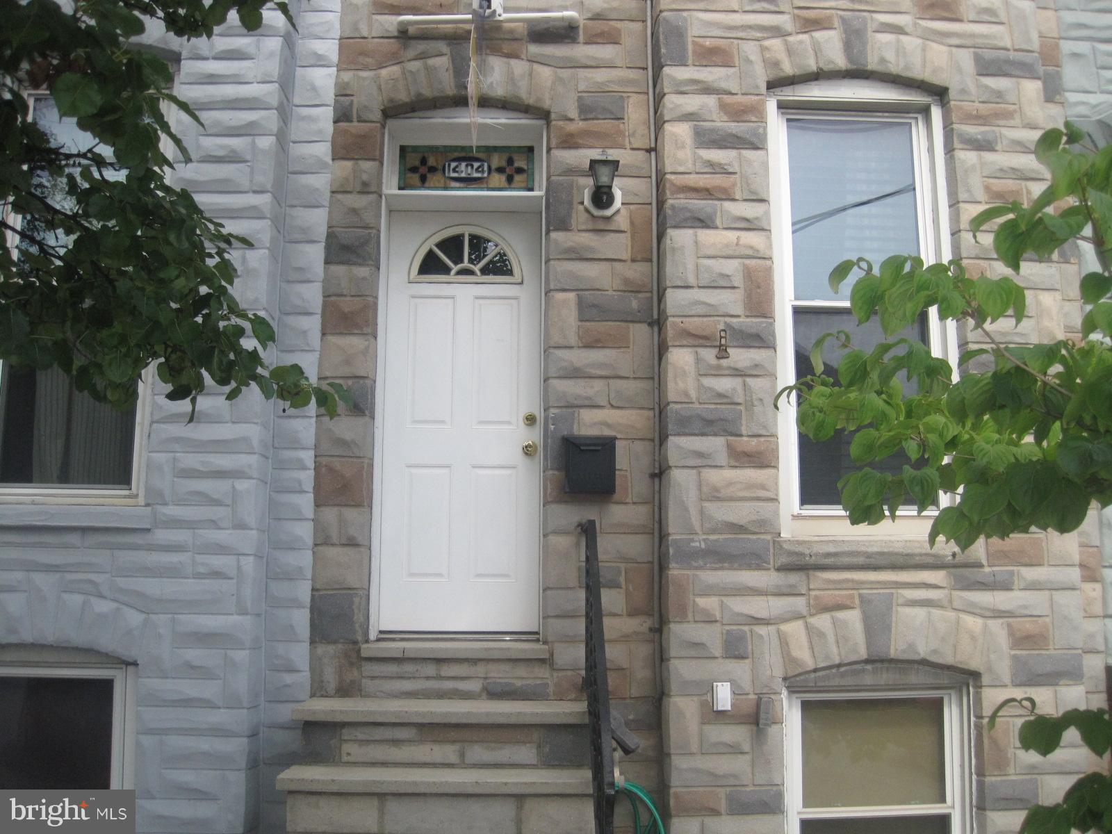 GREAT DEAL W/PARKNG! You couldn't ask for a better location! This 2BR, 1.5 BA house features exposed brick, hardwood floors throughout, dishwasher, washer/dryer, updated kitchen, central air conditioning, ceiling fans, rear deck, full basement for ample storage, mud room, and parking for 2 cars. All on a beautiful tree-lined street with waterviews and the Domino Sugar sign! Locust Point is centrally located near Federal Hill, the Inner Harbor, Ft. McHenry, and is just a few blocks from the Charm City Circulator and the free Harbor Connector water taxi. Restaurants and shopping McHenry Row just two blocks away. Easy access to I-95, too. Ideal location, super clean home, and lovely neighborhood. and TWO CAR PARKING make this a MUST SEE property!! The owner is RE. PLEASE NOTE A few photos are outdated. There is a new vanity and a front-loading washer/dryer.