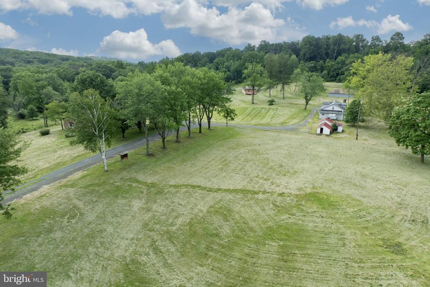 Incredible Opportunity on 120+ Acres in Montgomery County – Historic Retreat with Endless Potential and many uses
Nestled in a peaceful and secluded setting, this remarkable 120+ acre property offers a rare opportunity to own a piece of Montgomery County history. Currently used as a retreat, the estate features two charming stone historic homes in need of rehab, a spacious dining hall equipped with a full commercial kitchen, a bunkhouse can house 22 people with office spaces, ADA-compliant bathrooms, multiple utility/storage buildings, one utility building was formerly a pavilion used for outdoor cookouts, meetings, and community gatherings-and could easily be converted back from a utility shed to a pavilion, further adding flexibility for events and recreation. A ropes course adds to the property's versatility, making it ideal for retreats, conferences, therapeutic programs, or educational gatherings.
A unique feature is the 8.1-acre section (see plot plans) known as “Woodrock” which has a separate road access from Schaeffer Rd and is excluded from the conservation easement-opening the door for potential subdivision or future development. Woodrock does have multiple buildings on it in very poor condition and a basketball court. Please do not enter buildings. 
Zoned R-2, the property supports a wide variety of uses "by right," including residential, general farming, forestry, nurseries, detached dwellings, accessory professional office or personal services, accessory Instructional services and municipal uses. Additional uses are permitted by conditional use or special exception, offering tremendous flexibility. Potential options range from private schools, places of worship, riding academies, veterinary office, and kennels to camps, family day care, event spaces, recreational facilities, and therapeutic communities.
The site has a long-standing history of service to the community, formerly known as Fellowship Farm and now operating as Working Together. It has hosted summer camps, conferences, transitional housing, and wellness-focused programming.
The landscape is truly breathtaking with rolling hills, open meadows, a small pond, and wooded areas, all accessible via a long private drive. Incredible views from the top of the “outlook”  up the trail… make for some relaxing sunset cocktails overlooking the horizon/ valley. Fire pits and rustic rock circles, perfect for group gatherings, evening storytelling, or quiet moments of reflection under the stars. The property includes a conservation easement and a gas line easement. Please investigate how these may impact your use. Just minutes to Route 422 and Route 100 and under 40 miles from Philadelphia, this unique property is ideally located for a wide range of future uses.
This is a one-of-a-kind opportunity to own a vast, multi-functional property steeped in history and surrounded by nature, perfect for visionary nonprofits, institutions, or those seeking a secluded and flexible estate.
See listing agent for disclosures, easement documents, and township information before calling the Township; this may answer many questions and is a preferred method for the zoning officer. There are 2 parcels included in this sale, see agent remarks.