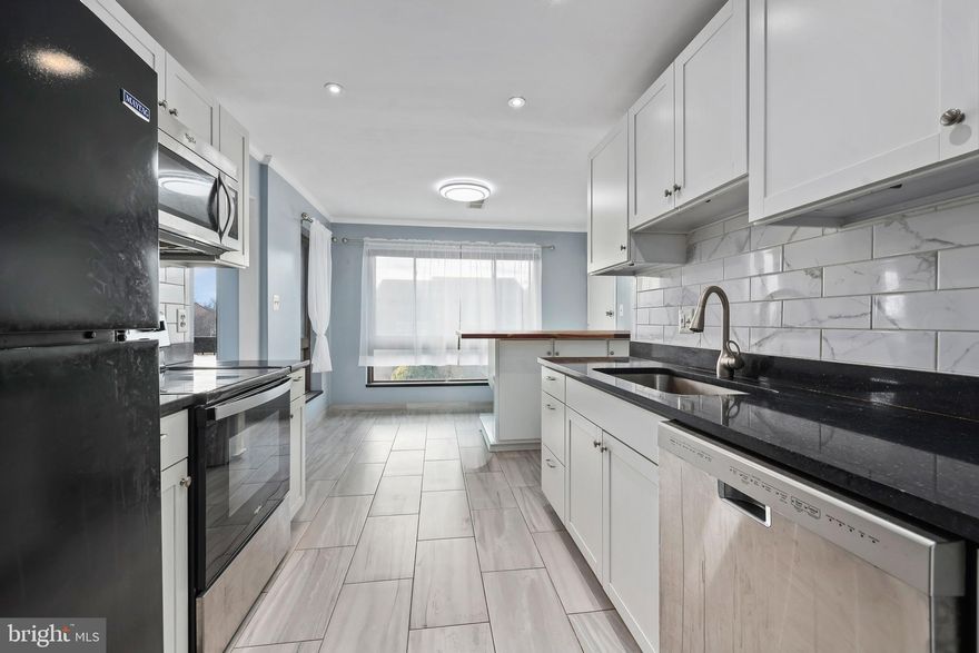 This fully renovated, spacious, and truly move-in-ready 2-bedroom, 2-bath condo offers 1,351 square feet of living space and features generously sized rooms and an in-unit tiled storage and laundry room for added convenience.  Located on the top floor of the building, the unit benefits from no neighbors above.

Conveniently located within 0.5 miles to downtown Herndon's  shops, restaurants, and popular community events. The owner’s suite easily accommodates a king-size bed and includes a walk-in closet and a beautifully renovated en-suite bath. The light-filled kitchen is a standout, featuring a peninsula with a custom butcher block counter, tile flooring, quartz countertops, tile backsplash, new cabinetry, and newer appliances. Both bathrooms have been recently updated with modern finishes.

Flooring has been upgraded throughout with luxury vinyl flooring throughout. The expansive living room is anchored by a wall of sliding glass doors that open to a private balcony, creating a bright and inviting space. Major systems have been updated, including a new HVAC system in 2020 and a water heater replaced in 2021. 

Condo fees include water, sewer, trash removal, and access to community amenities. The quiet community offers landscaped common gardens and a pool. One reserved parking space conveys, with ample additional parking for a second vehicle and guests. Located just one mile from the Metro and close to Dulles Airport, parks, and Reston Hospital, this home combines comfort, and convenience.