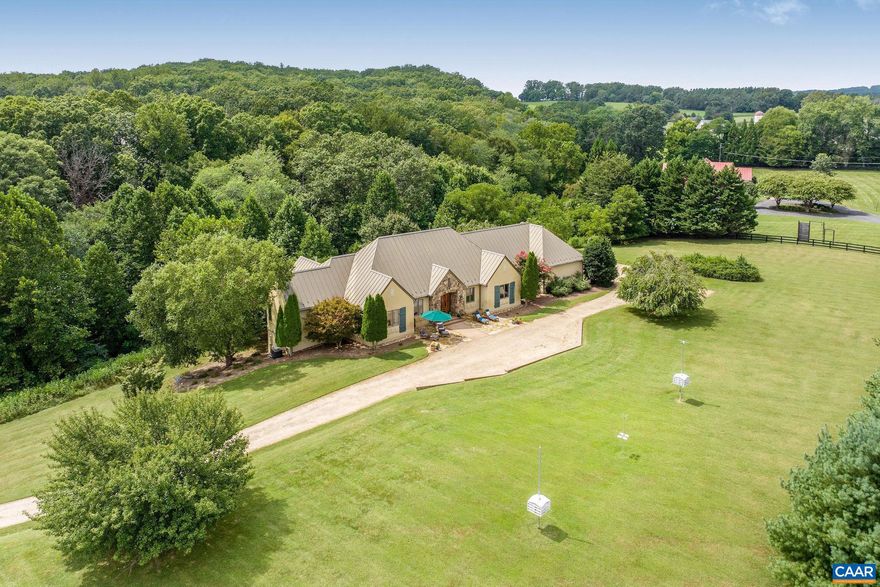 Set on nearly 4 peaceful, gated acres just minutes from town, Keswick, local vineyards, and renowned restaurants, this private retreat is designed for effortless main-level living. The heart of the home is the stunning, renovated chef?s kitchen, featuring double islands, abundant cabinetry, luxury appliances, beverage drawers, and thoughtful details throughout?ideal for gathering and entertaining. The kitchen opens to a light-filled family room with a stone fireplace and access to the serene back deck and screened porch, perfect for taking in the quiet natural setting. The main-level primary suite is a true sanctuary, boasting a spa-like bathroom with a freestanding tub, a custom enclosed shower/steam room and full size stackable washer/dryer. Two additional bedrooms, two full baths, and a spacious mud/laundry room complete the main level. A three-car garage adds convenience. The walk-out lower level includes a living area and flex space with built-ins, a private guest suite with full bath, a fitness area, and a second kitchen area, perfect for multigenerational living or long-term guests. Ample unfinished storage space and a 4th garage bay provide plenty of storage. Purchasers eligible for a 25% discount to the Club at Glenmore.,Fireplace in Family Room,Fireplace in Master Bedroom