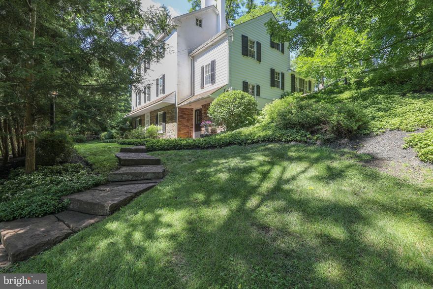 The owners are ready to part with this extraordinary residence.  Walnut Hill Farm, an impressive stone and plaster 1800's home and barn rests proudly on a wooded hillside in Bucks County just minutes from the Delaware River. Framed in a remarkable setting of almost 5 acres, there are bucolic vistas from every window. Park-like lawns gradually roll into the surrounding woods. Renovated to suit modern, sophisticated tastes by a NYC designer, this genteel estate offers the tranquil, soothing rewards of country life with luxury, modern amenities. A property with this lovely combination of sophistication and charm is rarely available and Walnut Hill Farm is ready to move in. Both inside and out, the 1800 s character and timeless dignity are evident. Random width flooring, open beamed ceilings, deep windows and period detailing skillfully blend with custom cabinetry, marble, tile and mahogany appointments. The gourmet kitchen boasts Viking appliances and opens to a sun room, bathed in light. Step outdoors on to the large terrace to bask in the park like setting. A stunning stone wall lines a portion of the property's perimeter, and lends a sense of substance, privacy, and tranquility to the backyard. The typical farmhouse rooms have been opened up to create comfortable living space that works equally well for entertaining. With fireplace walls at either end of the living room, random width plank floors and beamed ceiling, the original interior offers the soothing rewards of country life  with modern conveniences. An original pie stairwell leads from the first floor to the attic and includes built-in wine racks lining the walls. The master bedroom includes six deep set windows, fireplace and luxurious master bath with custom tile, double shower and wet steam sauna. A guest suite of 3 rooms on the first floor includes a private entrance, walk-in fireplace, beamed ceilings and newly designed bathroom. A Currier and Ives country barn offers garage and plenty of storage and workspace for hobbies, storage and studio. An acre lined with dog fencing allows pets to romp without worry. The perfect country getaway, Walnut Hill Farm is convenient to restaurants lining the Delaware River and gourmet food stores. Sophisticated and charming, you will not be disappointed by this rare Bucks County gem.