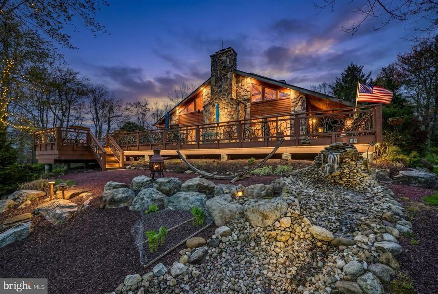 Serenity in the Pocono Mountains--Golf Course Living at Its Finest! Perfectly positioned on the 9th hole, this exceptional over 5000 Sq St. Cedar home on 1.24 acres with NO HOA offers breathtaking fairway views and a peaceful mountain setting. A paved drive leads you to this expansive retreat featuring a massive open floor plan highlighted by a dramatic floor-to-ceiling stone, wood-burning fireplace and rich wood flooring throughout the main living space. The heart of the home is a beautifully appointed kitchen with granite countertops, double oven, and seamless flow into a wet bar--perfect for entertaining. Enjoy year-round relaxation in the 4-season room or step outside to the expansive deck complete with hot tub, ideal for soaking in the serene surroundings on the hammock next to the water fall feature. The main level features a luxurious primary bedroom suite with private bath, a powder room, convenient butler's quarters and private study. Upstairs, an open balcony overlooks the grand living area and leads to four spacious bedrooms--each with its own private adjoining bathroom--plus access to a storage attic. The lower level is designed for fun and functionality with a large game room, bar area, storage room, utility space, and a 2-car garage. Additional highlights include central heat and air main level, a storage shed, and a Simply Safe secure alarm system. Enjoy a lifestyle of convenience and recreation with a private pathway to the Sunset Green Restaurant and Split Rock Golf Club. Ownership includes access to Lake Harmony--a motorboat lake--plus you're just minutes from skiing, water parks, and local nightlife. See it to believe it--this is Pocono living at its best!