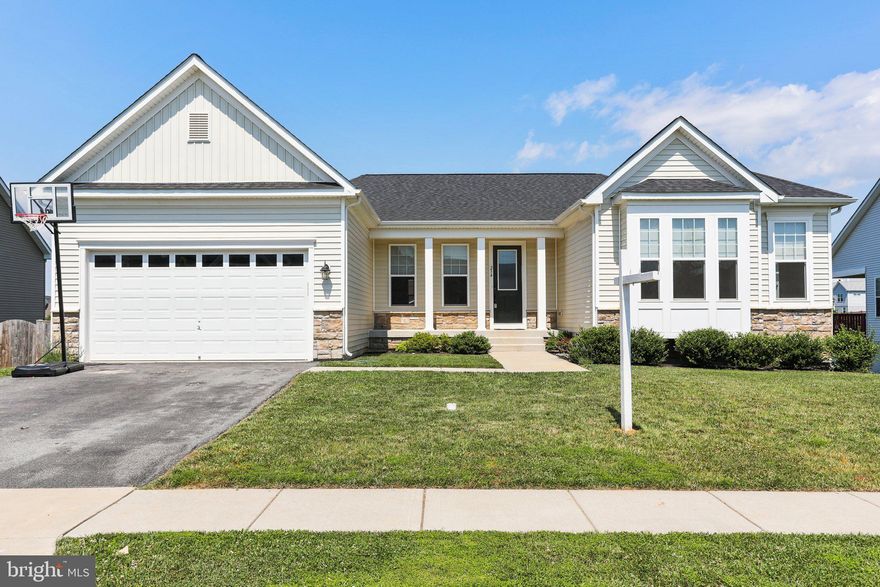 This well-kept rancher was built just five years ago and is located in sought-after Norborne Glebe, a beautifully landscaped neighborhood with sidewalks and lots of common space. This home has all the convenience of single floor living, but with even more space in the basement! The main level features hardwood floors, kitchen with granite countertops and large island, laundry room, and three bedrooms and two full baths. The primary suite and living room have Bose surround sound speakers and living room is wired for a projector.  The huge basement contains a large finished recreation room and full bath and has the potential to add an additional bedroom and rec room. You'll have plenty of storage space! In the back, you'll find a deck and patio, perfect for grilling this summer. Enjoy the fully fenced backyard. Home backs to common space and neighborhood walking path. Just fifteen minutes from Harpers Ferry and within easy driving distance of Winchester, Leesburg, and Frederick, and more. Bring all offers!