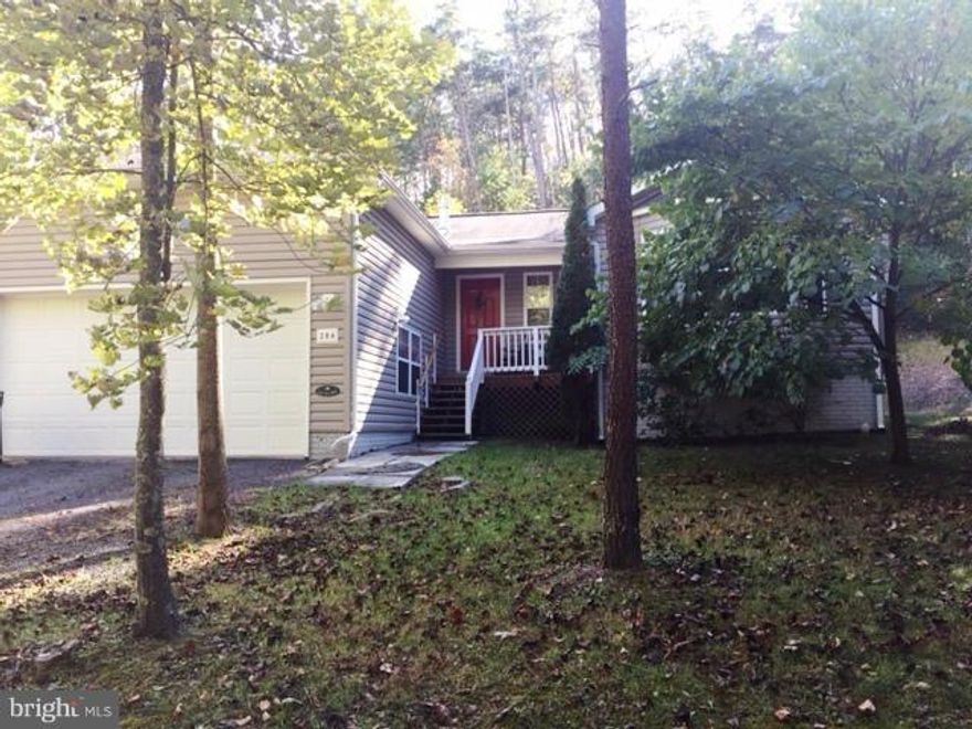 Buy A Piece of the Mountain! This 2001 - Single Family Home - One Level Living W/Unfinished Basement Is Ready For You To Move In. Wooded Lot, Large Kitchen, 3BR/2BA, Jetted Tub, Two Car Garage, Wood Floors, Guest Room W/Bay Window, Basement Has Rough In For 3RD Bathroom. Weekend/ Full Time Residence. Enjoy the Garage All Year Long And Keep Your Vehicle Out Of The Elements.