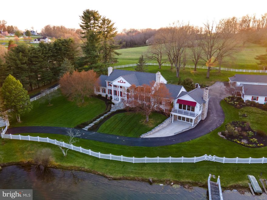 NOTICE: Available for showings with 24-hour notice.  Appointment confirmation upon Proof of Funds stating financial ability to purchase. From Ady Rd you will travel 630 ft through 2 electronically controlled gates assuring 24-hour security. The driveway has been recently paved giving years of service. When you reach the top of the driveway, the dwelling will be to your left and a relaxing gazebo will be to your right. THIS ESTATE is extremely unique and remarkably interesting in every aspect. The home has been carefully positioned high on almost 17 acres of agriculture zoning overlooking an amazing front yard which includes a 2-acre pond. Residing in the center of this pond is a 24’ X 52’ island  accessed by a 100-foot arched bridge. The pond’s secondary purpose is to support the geothermal HVAC system. To the right of the dwelling and gently to the rear of the main house are two other detached structures.  One being a 6-car garage measuring 64 X 24 with three double wide rollup doors. Across from the garage is a 64 X 28 carriage house, featuring a recently installed mini split HVAC system. Having central HVAC, this building offers a wide a variety of interests or hobbies that one may explore. The property is surrounded by a recently replaced vinyl fence. All gardens have been just manicured, and fresh mulch applied for the oncoming summer months.  The many gardens have an irrigation system suppling the needed water from the pond.  This palatial setting can be viewed through either of the 16 X 8 sliding window walls on both the first floor and second floor addition. Entering this home from the blue slate walkway and 8 X 28 Blue Slate Portico through the front door, a soaring 11 X 15 two story grand open foyer with marble flooring greets you as your eyes are affixed upon the grand circular staircase case showing what lies above you on the upper level. When you walk the stairs, you will see backlit niches and wall sconces. The first floor 10 foot ceilings will give the feeling this property was designed for a movie.  All ceilings have been designed with architectural designed unique patterns. Most of the flooring has been upgraded with Santos Mahogany Hardwood. The 4 wood burning Fireplaces will chase the chill away. Main level living room 15x22 with woodburning fireplace is decorated with hand painted delft tiles imported from Holland.  The 26x14 dining room with Butler’s pantry, sconce lighting, dual chandeliers and intricate crown molding is a formal setting for your guests.  A 12x21 family room off the kitchen has a fireplace with free standing wood stove.  The walls and ceiling are tongue and groove wainscoting.  An eclectic 14x25 kitchen is in the heart of this home. An attached 3-season room with skylights is just steps away.  A 21x28 two-story addition built in 2009 allow one to capture all the scenery and outdoor activity through the huge sliding doors and spacious use of windows. The dwelling features 6 bedrooms and 4.5 baths. There are 2 primary bedroom suites, one on the main level and a second one on the upper level. The main level primary has been recently updated with luxury features including steam shower, dual vanity sink and bidet. The bedroom also features dual ceiling fans and a walk-in closet.  It connects to the second level of the additional 2 story 21x28 bonus room with fireplace, oversized widows and sliding doors offering an amazing view of the estate.  The entire home is complimented with extensive use of hard wood trim throughout. The basement has been set up depicting a street found in New Orleans giving an excitement to any party. It also has features an old-style ice-cream parlor/soda shop room. This street has many store fronts on either side waiting for your own personal preference. Next there is a 26X28 Red Carpeted Casino Room waiting for your next party. Finally there is a 21x28’ bonus room with fireplace, oversized widows and sliding doors offering an amazing view of the estate.