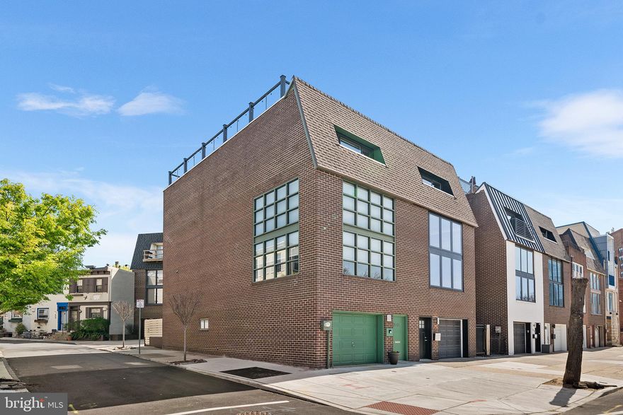 Open House CANCELED. Welcome to 2323 Pennsylvania Avenue — A modern Fairmount gem with unrivaled Art Museum views. Perched on one of Fairmount’s most coveted corners, this rarely offered 3-story brick-front residence offers a luxurious lifestyle in the heart of the city. Enjoy the commanding views of the Philadelphia Museum of Art and an unbeatable location. Step into the versatile ground-floor den, a perfect blend of comfort and functionality. This inviting space offers  a convenient serving station—ideal for hosting gatherings or enjoying a quiet evening. The den opens directly onto a private, fenced yard, offering a seamless indoor-outdoor living experience. This level is completed with a utility room, and access to the 1-car garage.The 1st floor open-concept living space featuring oversized industrial-style windows, soaring ceilings, and rich hardwood floors throughout. The living room and dining area, framed by stunning views of the Art Museum, flows seamlessly into the kitchen. The kitchen offers seating at the breakfast bar and include stainless steel appliances, granite counters, and custom cabinets. The next level is the master suite, which features hardwood floors, recessed lighting, a walk in closet, and custom cabinetry a built-in vanity. Upstairs, the home offers two generous bedrooms and a beautifully updated bathrooms featuring beveled subway tile. The roof deck has composite decking and is easily accessed through the pilot house. The views offer front-row seats to Philly’s iconic skyline and the Eagles Super Bowl Parades, The Philadelphia Marathon, Thanksgiving Day parade, and many others.   A new central air unit (2023) ensures year-round comfort, while a 1-car garage adds rare convenience in this walkable neighborhood. A gated rear patio adds additional outdoor space for relaxing or hosting. Just steps from Kelly Drive, Boathouse Row, Whole Foods, and Fairmount’s best restaurants and cafés, this home is your front-row seat to Philadelphia’s vibrant cultural scene. Don’t miss this extraordinary opportunity to own a signature address in the heart of Fairmount. Showing begin Wednesday April 23rd.