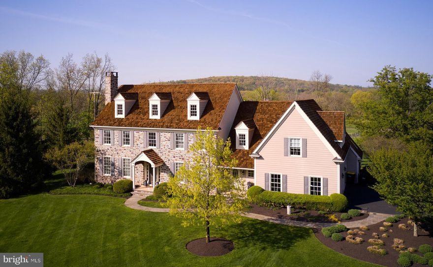 Welcome to this stunning home  where luxury and comfort meet in perfect harmony in a beautiful enclave of custom homes, Lookaway Court, perfectly situated on a corner lot and backing to the picturesque Lookaway Golf Club.  As you approach the front entrance, you are greeted by a beautiful two-story foyer, boasting elegance and sophistication. The formal living room is to your left, featuring a cozy fireplace, where you can relax and unwind in the warmth of the flickering flames.  The formal dining sets the tone for magnificent dinner parties or holiday gatherings.   The great room is just beyond the living room, also boasting a beautiful stone fireplace that extends up to the second floor, creating a grand and impressive atmosphere. This two-story great room is the perfect space for entertaining, with plenty of room for guests to gather and enjoy each other's company.  The kitchen is brand new and absolutely stunning, featuring a gorgeous island that is perfect for preparing meals or hosting a casual gathering. The brand new coffee bar adds a touch of luxury to your mornings, making it easy to start your day with a fresh cup of coffee.  Convenience is key in this home, with both main and lower level laundry rooms available for your use.   The new MAIN FLOOR laundry room is a convenient and practical update, making chores a breeze. The main floor study, complete with a wet bar, is the perfect space for a home office or quiet retreat.  Walk upstairs using either the formal grand staircase or the rear staircase,   the Primary Suite is truly a retreat, featuring vaulted ceilings and beautiful views of Lookaway Golf Club.  It  is a true oasis, complete with a soaring two-story ceiling, a sitting area, and a walk-in closet. The updated Primary bathroom is a true oasis, complete with all the amenities you need to pamper yourself after a long day.  Three beautiful guest bedrooms provide plenty of space for family and friends, with a beautifully updated hall bathroom for their use.   And, what home wouldn't be complete without a three-car garage.  Overall, this home is a perfect blend of elegance, luxury, and convenience.   Then, step outside to the fenced yard and take in the gorgeous, professionally-designed gardens by a local well known landscape architect that surround the entire property.   And, to help maintain these breathtaking gardens is an irrigation system. The backyard oasis boasts an inviting, in-ground  pool, perfect for entertaining family and friends. Enjoy evenings on the deck or in the screened-in porch, which provides the perfect vantage point for breathtaking views.  And, the entire side and rear yard is fenced!  With its stunning features and beautiful surroundings, it is a true gem that you'll be proud to call your own.  Located in a highly sought-after community, this home offers a serene retreat while still providing easy access to nearby shops, restaurants, and entertainment options. Don't miss out on the opportunity to make this exquisite property your own.  Some of the updates: Cedar roof pressure washed, and preserved cedar, roof company, New well tank, New septic pump, New heating and air conditioning with high-efficiency and hybrid system , Replace carpet with hardwood back staircase and upstairs hallway, New kitchen and a new bar/coffee station added, New laundry room on the main floor, owned 1000gallon propane tank, WHOLE HOUSE 22k Generac Generator, Post and rail fence backyard, new beautiful main floor powder room,  New quartz top and sinks in the primary bath  with new lighting and custom mirror, Screened in porch newly painted with new ceiling fan, Deck stained and Trim and windows painted outside!!!