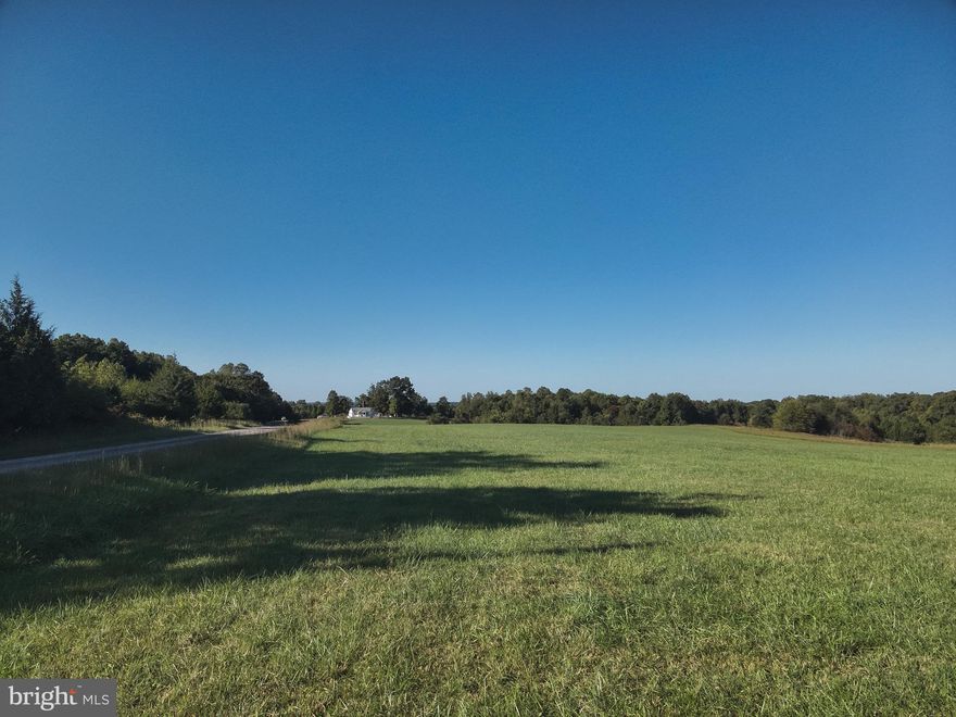 This spacious 5.002 acre lot is a canvas of opportunity, offering a generous expanse of somewhat level terrain for your home. The gently sloping land provides a balance between easy construction and however you wish to enhance with landscaping. Its size allows for ample space to design your residence while still leaving room for a large garage/workshop or garden area.