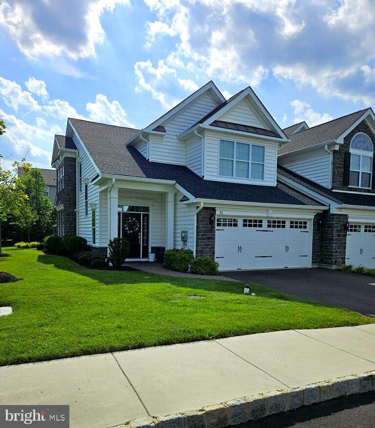 This stunning end-unit carriage home is located in the prestigious Regency at Yardley, a premier 55+ gated community in Yardley, PA. Built in 2020, this meticulously maintained 2-bedroom, 2.5-bathroom home offers a perfect combination of modern luxury and low-maintenance living.
Step through the covered front entrance into a dramatic two-story foyer that opens to a bright and airy layout. The main level features a gourmet kitchen with high-end finishes, flowing seamlessly into the dining area and spacious great room. A gas fireplace adds warmth and ambiance to the great room, while an abundance of windows fills the home with natural light.
Enjoy the convenience of first-floor living with a spacious primary suite that includes a walk-in closet, double vanity, and a tiled shower with built-in seating. The first floor also includes a laundry room, a powder room, and direct access to the attached two-car garage.
Upstairs, the second bedroom offers its own full en suite bathroom and walk-in closet, making it ideal for guests. A versatile loft provides space for an office, den, or reading nook, and there’s also an unfinished storage area for added flexibility.
The monthly HOA fee includes landscaping, irrigation, roofing, snow removal, and access to a wide range of resort-style amenities, such as a clubhouse, indoor and outdoor pools, a fitness center, and a variety of social activities.
This is a rare opportunity to enjoy an active, carefree lifestyle in one of Bucks County’s most desirable communities.