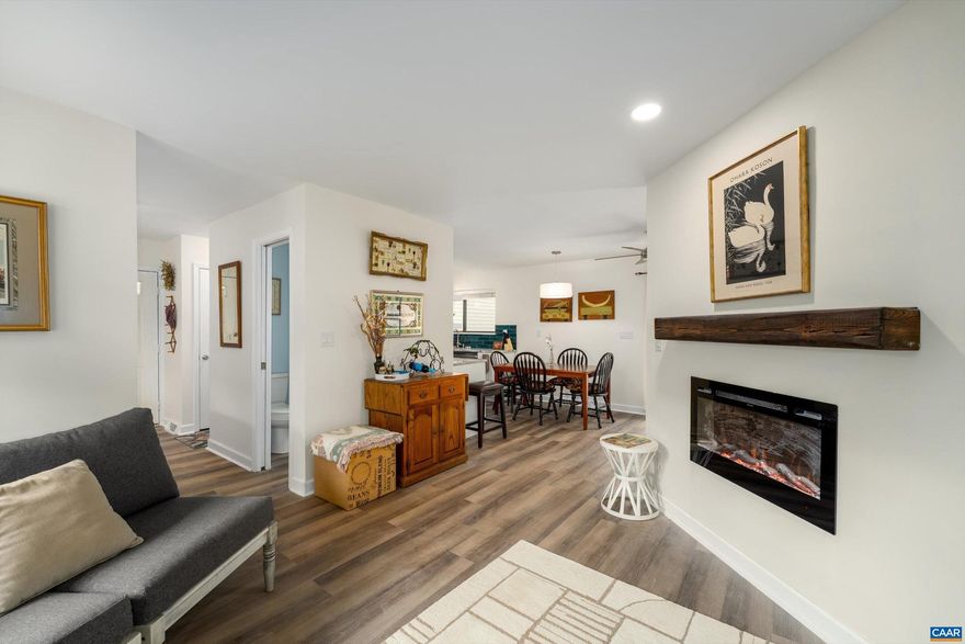 RIVERRUN GEM with community pool is a light filled, completely renovated home in a desirable, cozy and charming place to work from home & relax. All new, including luxury vinyl floors with neutral decor, open concept with a cook?s delight kitchen, LG stainless steel appliances, granite counters, a home office or sitting area off the kitchen with sliding doors to a private deck to enjoy morning coffee.  New ceiling fans with dimmers throughout the home. New wiring at all electrical outlets and switches. All appliances are 2025 ENERGY STAR.  A nice separate utility room is downstairs with storage by the hallway and the two light filled bedrooms.  The primary bedroom is very large with a walk in closet.  Two gorgeous new bathrooms with new plumbing to enjoy; the hall bathroom is great for guests.  2021 new roof.  New 2025 HVAC and  water heater.  New 2025 smoke detectors throughout. New 2025 insulation materials to keep your electric bills low and for best sound barrier from neighbors.  You can easily install a fence with HOA approval for a pet or for privacy. Amazing location being 10 minutes to Route 29, shopping, UVA, PVCC. Pen Park offers tennis & golf. Great rental investment for income. Backs to wooded area for a nice view.,Granite Counter,Fireplace in Living Room