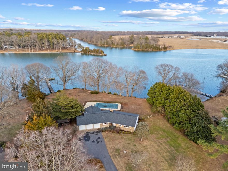 Welcome home to your soon to be dream waterfront estate!

Nestled on a picturesque one and a half acre lot in the coveted Governor Grason community, this charming home offers a prime opportunity to create your dream waterfront estate. With breathtaking views of the Wye River, the property features deep-water access (approx. 9ft MLW), waterfront in-ground pool, private pier with water and electric, and so much more! The perfect location for boating enthusiasts, outdoor lovers, and those looking for a peaceful retreat just minutes from the Chesapeake Bay Bridge on the Eastern Shore.

The home provides three generously-sized bedrooms and 3 bathrooms, including a main-level primary suite with easy access to the expansive living and dining areas. Multiple living rooms throughout the home offer panoramic views of the Wye River, ensuring that every day feels like a waterfront getaway. The additional bonus bedroom downstairs provides versatility and privacy, ideal for guests or a home office.

The interior of this home offers plenty of extra space to customize it to your needs - the perfect foundation for additional bedrooms, personal touches, and modern updates including a large open kitchen.
The three-car oversized garage and plenty of additional storage options provide both practicality and function, while the prime location, just minutes from Route 50, offers quick access to local shopping, dining, and attractions in the surrounding areas. Popular destinations such as Kent Island, Annapolis, Saint Michaels, and more are just a quick drive or boat ride away. 

Whether you're looking to move in and update gradually or embark on a full transformation, this property offers incredible potential in one of the area's most sought-after areas of the Eastern Shore. Schedule your tour today!