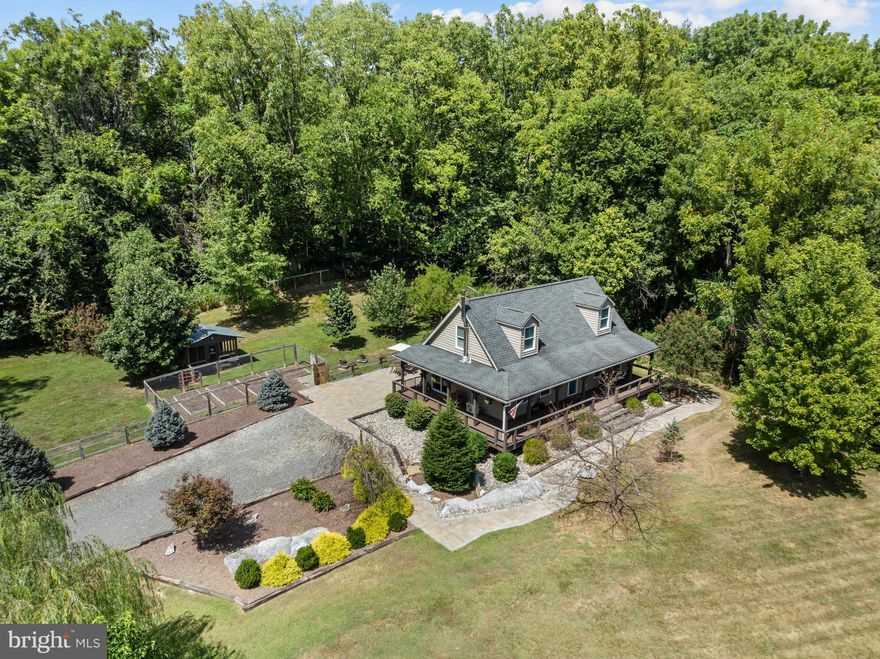 Welcome to 651 Stratford Lane — a warm and inviting Cape Cod-style home tucked away on just over 2 private acres in the desirable Avon Bend community of Charles Town. This move-in ready property offers the perfect blend of comfort, updates, and nature, with direct access to the Shenandoah River just a short walk away.
The large wraparound porch invites you to relax and take in the peaceful, wooded surroundings. Step inside to a bright, open layout featuring exposed wood beams, a wood-burning stove, and a spacious family room that flows effortlessly into a modern kitchen. Here you’ll find granite countertops, stainless steel appliances, a stone island, built-in wine cooler, and a charming glass-door pantry.
The main level includes a bedroom, full bath, and a generously sized laundry/mudroom. Upstairs, the primary suite is a standout with a walk-in closet, built-in shelving, window seat, barn door, and a beautifully designed en-suite bath with dual showerheads and custom tilework.
Outdoors, the fenced backyard includes two outbuildings—one with electric and water—making it ideal for a workshop, studio, or hobby farm setup. With room for chickens, gardens, and more, this property is ready for your vision.
Located minutes from downtown Charles Town with quick access to Rt. 340 and Rt. 9, this home offers both privacy and convenience. High-speed internet is available, and the community provides access to the scenic Shenandoah River—perfect for fishing, kayaking, or relaxing by the water.
Don’t miss your chance to own this unique and peaceful retreat. Schedule your private tour today!