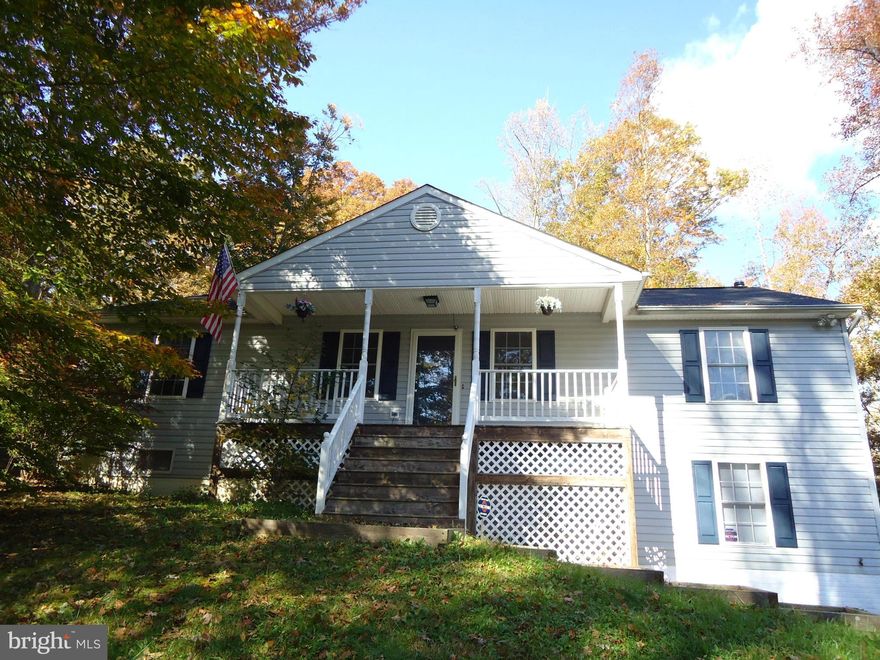 PRICED TO SELL!  Must see raised rambler with incredible basement build out to use as Master Suite or guest quarters!  Size-able bedrooms, open floor plan with large country kitchen & center island.  Sit on your front porch and enjoy the privacy of this beautiful home nestled on 1 acre tree'd lot.  This home is a GEM...large parcel without the price!  Great location for N.VA commuters and Quantico