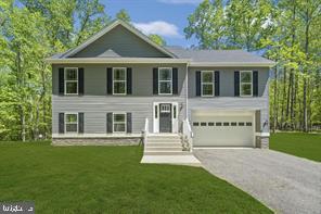 Create your brand new dream home with joy and ease! The $436,160 price is for a spacious 3 bedroom, 2 full baths and 1 half bath Colonial style new home with a 1 car garage on 1 acre. To add additional space, there are 2 and 3 car garage options and an unfinished and finished basement options as well. Some of our standard features are stainless steel appliances (electric), built in microwave,42'' designer kitchen cabinets, Moen plumbing fixtures, granite counter-tops in the kitchen, recess lighting in the kitchen, and carpet and vinyl flooring throughout. Options to upgrade to hardwood or plank wood floors, optional kitchen island, deck, and additional lighting are available. Design each room of your home by choosing from our beautiful color palettes and finishes.