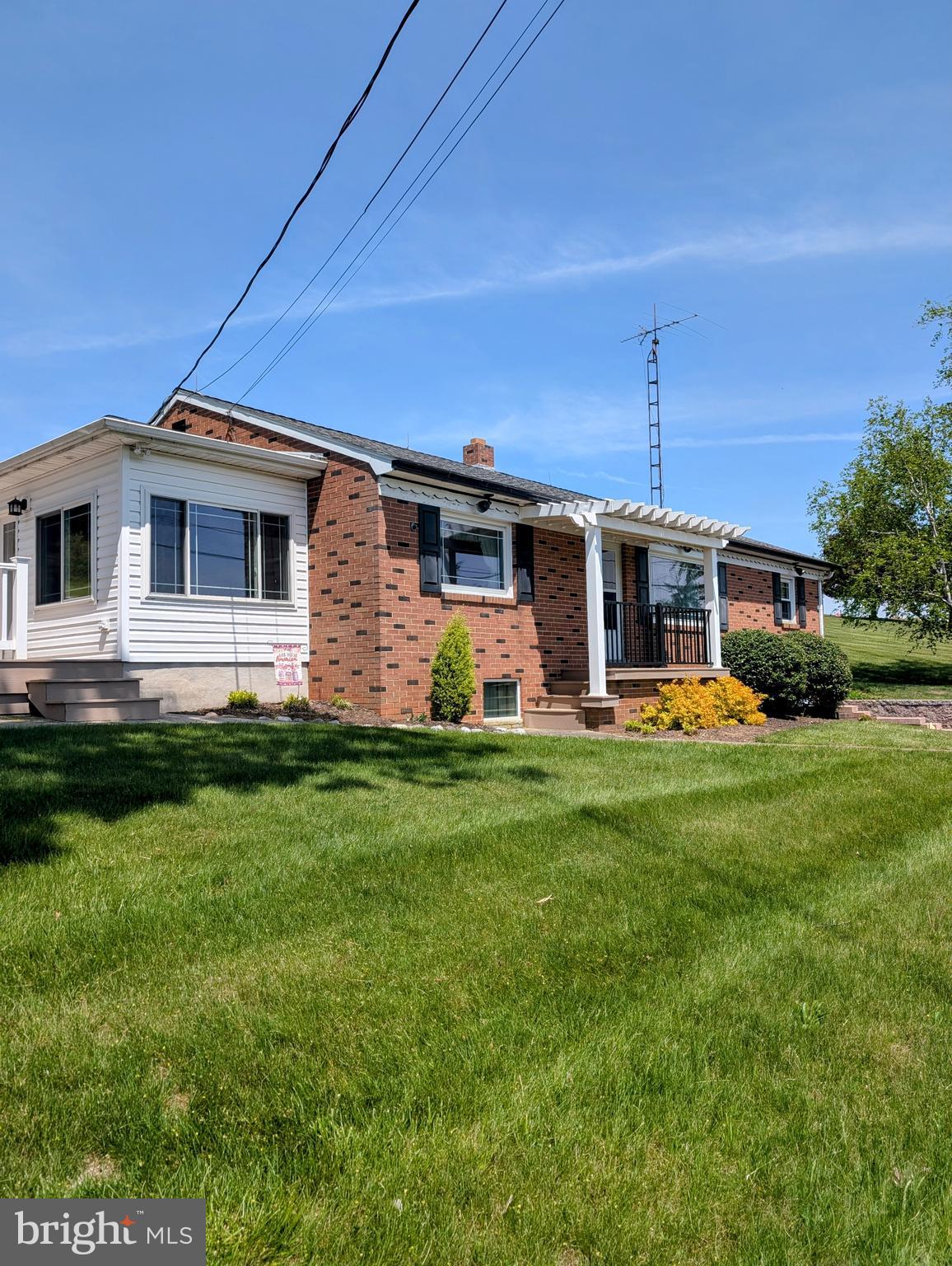 This property is being offered at a live onsite Public Auction on Wednesday, August 6, 2025 at 6PM. The listed price is not the sale price and sale price is subject to seller confirmation at public auction. Buyer Pays All Realty Transfer Taxes. Property Taxes Prorated at Settlement, Settlement by September 17, 2025. Property consists of a 10+ acre farmette with a well kept one story home with 2/3 bedrooms, 1 1/2 baths, large living room with picture window, large county kitchen w/dining area, den/office area, lower level family room w/brick fireplace, enclosed side porch and a trex style deck w/ramp. 2 story rental cottage with 2 bedrooms, 1 full bath, living room w/fireplace, updated eat in kitchen, enclosed rear porch and landscaped rear patio. Other improvements consist of a 7,000 +/-SF former hog barn with Harvestore Silo and feed bins, 56x64' bank barn with lower level box stalls, 3,500SF newer pole barn with concrete floor and large overhead door access, a 30'x32' garage/pole barn adjacent to the main house, and an onsite spring with springhouse, a spring fed pond and 2 large fenced pasture areas. Great country location with many uses possible. Seriously for sale - Don't Miss it!!