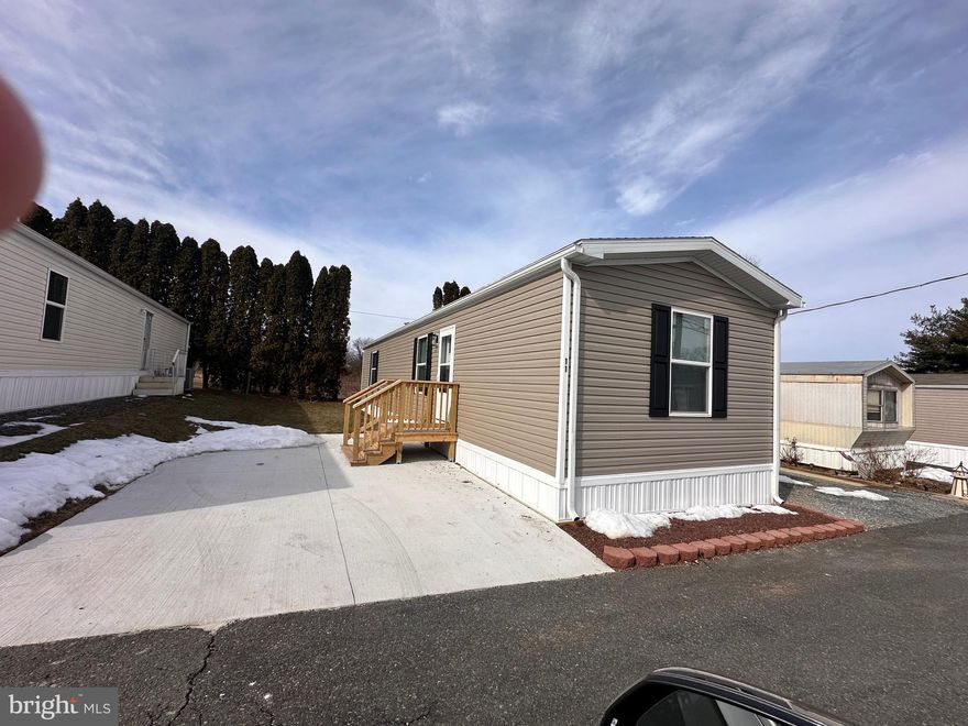 Brand New all 1 floor manufactured home with  2 bedrooms and 2 baths. Very nice kitchen that flows into the living room. Open area laundry room. Front bedroom has a closet and its own full bath. Larger main bedroom also has its private bathroom with larger tub/shower and a  nice closet as well.  Concrete parking spot included. Base lot rent of $675 per month. Utility fees of $60 per occupant which includes refuse, water, sewer, common area maintenance including snow removal, mowing and landscaping. Owner is responsible for their yard mowing and driveway snow removal. Pets are permitted but there are restrictions and fees on a monthly basis at $20 per pet per month not to exceed 2.