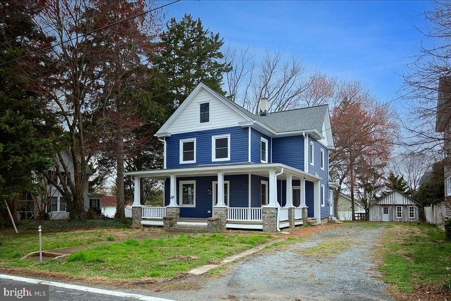 Step into timeless charm with modern updates in this beautifully renovated early 1900s home located in the heart of Kennedyville. Offering 4 bedrooms, 2 full baths, and a versatile third-floor loft, this home seamlessly blends classic character with today’s conveniences.

From the moment you arrive, you’ll be drawn to the inviting wraparound front porch—perfect for relaxing and enjoying small-town living. Inside, the home has been thoughtfully updated from top to bottom, including brand new siding, windows, roof, and HVAC system for added peace of mind.

The interior showcases a stunning transformation featuring refinished original hardwood floors, fresh paint throughout, and a completely updated kitchen with granite countertops and brand new stainless steel appliances. Both bathrooms have been tastefully renovated, offering a clean and modern feel while complementing the home’s historic charm.

Additional highlights include a convenient laundry/mudroom off the rear of the home and a flexible third-floor loft space—ideal for a home office, playroom, or guest retreat.

Out back, you’ll find a detached carriage house equipped with electric (100 amp service), heat, and A/C—perfect for a workshop, studio, or additional storage.

Situated in the quaint town of Kennedyville, this property offers the perfect balance of historic character, modern upgrades, and small-town charm.