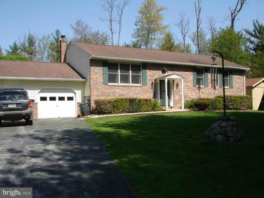 Wow!  Fantastic  home on great lot!  Convenient yet private. Designer colors.  Meticulously cared for and maintained.  Manicured lot backing to trees for a total of 5+ ac.  Walking trails and stream.  Expanded storage shed and boat storage shed.  Lower level family room with wood stove plus finished guest room and office.( Set-up so could be converted to in-law suite).   Move in ready++