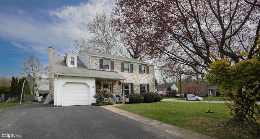 Welcome to Rolling Green—one of Springfield’s most sought-after neighborhoods—where this classic stone-front Colonial offers space, flexibility, and thoughtful updates throughout. This 4 bedroom/2.5 bath home blends timeless curb appeal with modern functionality, highlighted by an expanded main level designed to fit today’s lifestyle. Step inside to a center hall with a large closet and convenient main floor half bath. From here the floor plan opens and you can find a spacious and inviting layout featuring a versatile main floor addition that creates endless possibilities. This main level features a traditional living room, dining room, and kitchen with an adjoining family room. Whether you envision a cozy sitting room, bright breakfast nook, private home office, fitness space, mudroom, creative space for your or the family, or even an oversized pantry, this flexible floor plan adapts to your needs. The updated bathrooms add a fresh, modern touch, while the finished basement provides valuable additional living space—perfect for entertaining, relaxing, or creating a separate play or media area. The second floor boats a primary bedroom with an en-suite bath and a 10'x4' walk-in closet, as well as a sizeable 2nd bedroom with a double closet AND "sewing room"/ walk-in bonus space for a closet, hang out space, or whatever your creativity needs. The 3rd and 4th bedrooms are also generous with large closets. Out back, the private deck offers a great setting for outdoor gatherings or quiet evenings, extending your living space outdoors. Off the deck to the rear yard with shed and a large side yard ideal for playtime, having a catch, practicing lacrosse, and more! With four generously sized bedrooms, ample storage, and a layout designed for both everyday living and entertaining, this home checks all the boxes. Ideally located just minutes from Baltimore Pike shopping and dining, major routes including 476 and 95, and easy access to the Philadelphia airport, Center City, tax free DE, and King of Prussia.