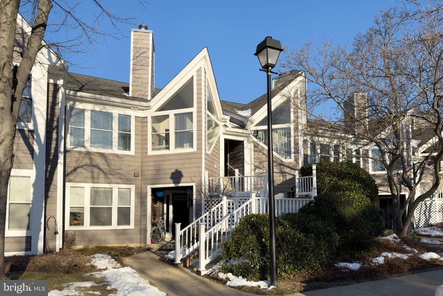 Stunning top-floor condo located in sought-after Woodland Village featuring soaring ceilings and an open-concept floor plan that is filled with natural light! This condo offers luxury vinyl plank flooring throughout, durable and easy to maintain. The kitchen features white cabinets and stainless steel appliances. The living/dining combo offers plenty of space for casual living and dining. The versatile sunroom is the perfect place to relax and unwind or could function as a great home office. This unit features two bedrooms and two bathrooms. Both bathrooms have been thoughtfully updated with clean, modern touches including a new tub/shower combo, crisp white vanities, and quartz countertops. Woodland Village offers great community amenities including an outdoor pool, tennis courts, and a playground. The neighborhood is convenient for shopping, dining, recreation, and major commuter routes. This home is ready for immediate occupancy. Schedule your tour today!