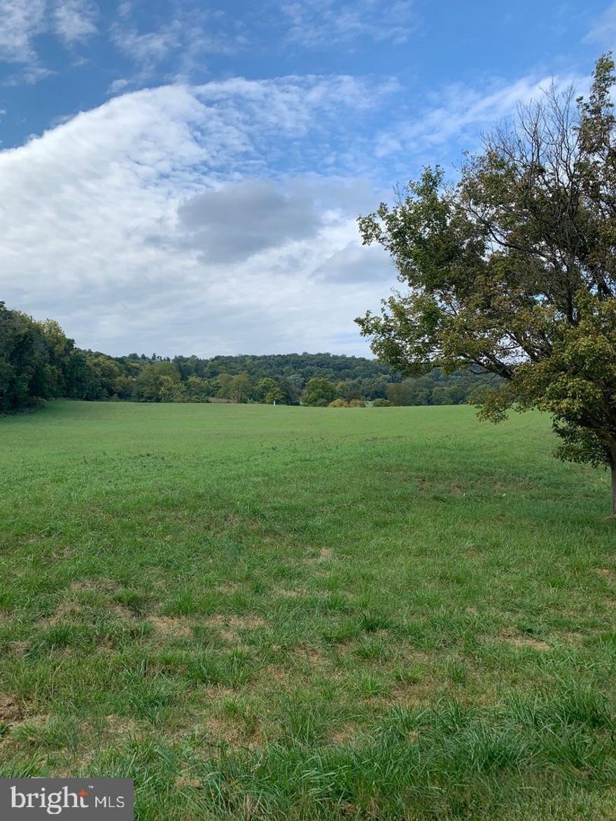 What a beautiful lot to build on, surrounded by undulating hills, mountain ridges, and pastoral valleys. Imagine the picture windows you'll enjoy. Welcome home to 5+ acres in Catoctin Meadow. Lot #1 of a 5 lot Executive Homesite sub development conveniently located just outside of Frederick, MD in Myersville and within the Middletown school district. Recorded lot is approved for 6 bedroom perc. Well in place with substantial flow (details upon request). Underground utility service at property line. Minutes to I70, Frederick, Middletown, and Hagerstown. Stop the tiresome search for homes in this low inventory market and build EXACTLY what you want with Little Catoctin Creek just a stones throw away - adventures and memories abound!