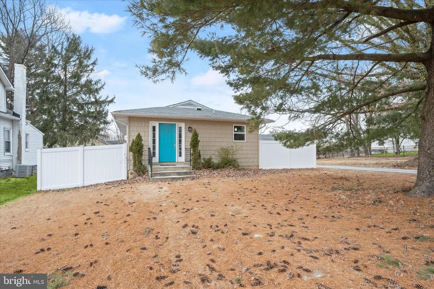 Introducing this charming ranch-style home offering four bedrooms with two and a half bathrooms spread across two finished levels of living space. Step inside into the welcoming living room adorned with crown molding, rich hardwood floors and a neutral color theme that continues throughout. The eat-in kitchen boasts granite countertops, a subway tile backsplash, soft-close cabinets, stainless steel appliances with gas cooking, and the dining area. Located on the main level, the primary bedroom suite features its own private bathroom with a walk-in shower, and a sizable closet. Two additional bedrooms and a shared hall bathroom finish this level. Downstairs, the fully finished lower level expands the living space with a large recreation room, half bathroom, and the fourth bedroom. Also located on this level is a laundry room and plenty of storage space. Enjoy spending time outside in the backyard with a privacy fence, patio and storage shed. A convenient parking pad across from the side yard can easily accommodate two vehicles.