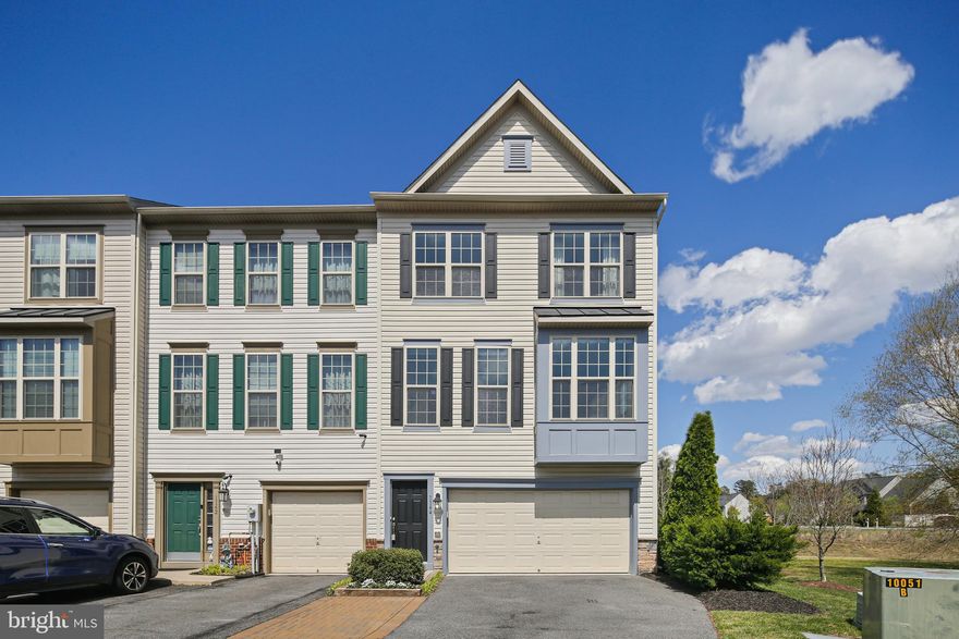 Welcome to 1144 Carinoso Cir, an impeccably maintained townhome in the highly sought-after Millstone Village community of Severn. This spacious 3 bedroom, 2 full and 2 half bath home features three finished levels of stylish living space with thoughtful updates throughout. The open-concept main level boasts gleaming hardwood floors, a modern kitchen with granite countertops, stainless steel appliances, a large island, ample space for a family dinning table, and slider access to a massive deck.  Perfect for entertaining! This level has large windows, with custom blinds, on every wall. Letting in an abundance of natural light. Upstairs, the expansive primary suite offers a walk-in closet and private en-suite bath with dual vanities, a soaking tub, and step in shower. Two guest rooms, full guest bathroom, and designated laundry space complete this upper level. The entry-level includes a versatile bonus room ideal for a home office, gym, or additional living space, along with access to the 2-car garage, and slider walk out access to a second deck space. The back yard is spacious and fully fenced in. The home was meticulously maintained by the owners. New Roof, 40-year shingle, installed in 2023. Conveniently located near Fort Meade, NSA, major commuter routes, shopping, and dining—this move-in-ready home is a must-see!