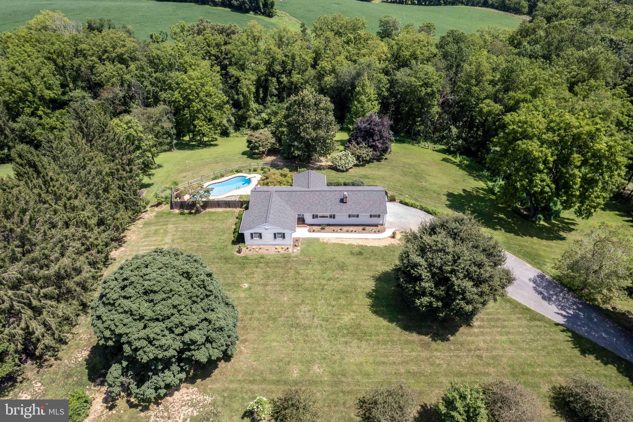 Open House Sunday 1-3PM*Welcome to this stunning, fully remodeled (2024) custom 4BR, 2.5BA rancher—tucked away at the end of a quiet cul-de-sac in sought-after Finksburg (despite its Reisterstown zip code)*Perfectly positioned on over 3 serene acres, this private oasis offers a rare combination of luxury, function, & outdoor lifestyle, including a resort-style inground pool*The exterior showcases a beautiful balance of open yard & mature trees, along with countless upgrades: new roof, new concrete walkway, charming covered front porch, side-loading garage, & oversized asphalt driveway—ideal for RVs, boats, or multiple vehicles*A large maintenance-free deck with wrought iron railings overlooks the fenced rear yard & sparkling pool—perfect for entertaining or unwinding in total privacy*Step inside to a bright, open-concept layout featuring a welcoming foyer & a beautifully flowing kitchen, dining, living, & family area with wood burning fireplace*The heart of the home is the gourmet kitchen, equipped with quartz countertops, custom cabinetry, new stainless appliances, a large center island, & designer backsplash* Enjoy both luxury wide plank vinyl flooring, ceramic tile, & solid hardwood flooring throughout*The spacious primary suite offers a tranquil retreat, complete with a fully remodeled bathroom boasting custom tile work*One additional bathroom has also been tastefully renovated*One of the standout spaces is the expansive four-season sunroom, flooded with natural light & its own dedicated HVAC—ideal as a studio, home office, or extra lounge space*The lower level is ready for your finishing touches & includes a convenient "camper style" half bath, perfect for guests using the pool*In this area also contains a new high end full house water treatment system*New French doors open to a covered rear patio area, seamlessly connecting indoor & outdoor living spaces*Zoned for Carroll County schools (Sandymount, Shiloh, Westminster High) & located just minutes from the Baltimore County line—this home offers peaceful countryside living with easy access for commuters*The 3+ acre lot even allows for the potential of horses (please verify with zoning) or other animals*This one checks all the boxes—don't miss the opportunity to make this rare Finksburg retreat your forever home!