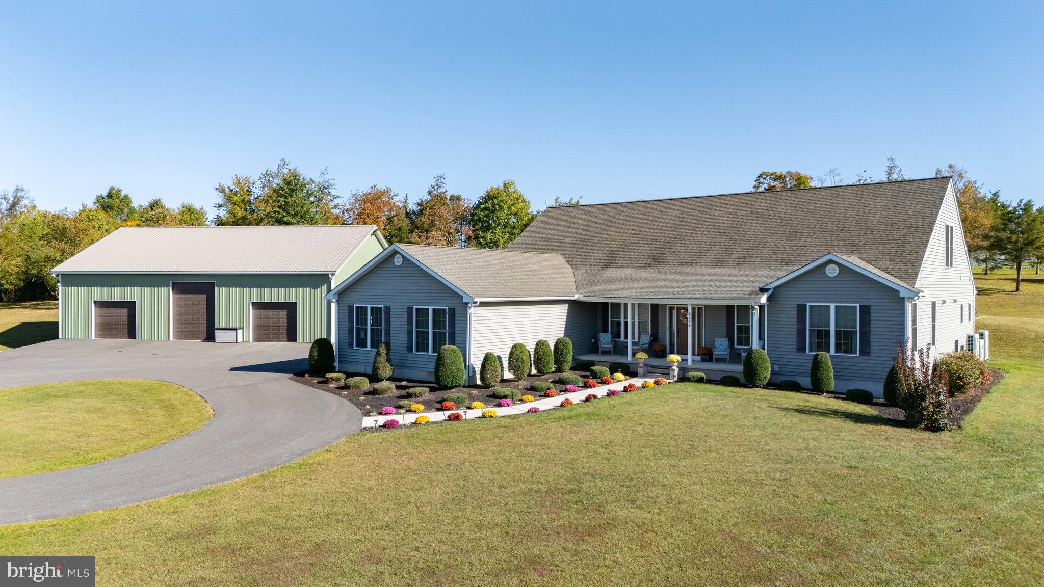REDUCED…!! Do not sleep on seeing this AMAZING property! The meticulously maintained home was built in 2017 and has 5 bedrooms, 3 full baths, and 2 half baths and has 4638 sf of above grade living apace and sits on nearly 6.5 acres. The main level offers an open floor plan and has LVP flooring throughout (with the exception of the owners suite). Set up like a ranch style home on the main level, you'll find 3 bedrooms and 2.5 baths. The massive gourmet kitchen has soft close cabinets, granite counters, tile backsplash, and professional style Thermador stainless steel appliances to include a 48' gas range with steamer oven, warming drawer and pot filler above as well as a 54" wide refrigerator/freezer. The kitchen also has a large center island with a prep sink and a breakfast bar. Living room is open to the breakfast nook with sliders to rear composite deck and a dining room. On the left side of the house, you'll enter through the garage to find the entrance to the upstairs in-law suite on the right and the laundry suite to the left. Bedrooms 2 and 3 share a Jack and Jill bathroom. The Owners suite is on the right side of the house and has a sitting area, 2 walk-in closets, and a large bath with tiled shower and soaking tub. Upstairs in the newly completed in-law suite is 2 additional bedrooms, a full bath, and a living room. The partially finished basement has a theater room which includes theater seating, theater system, and a projector. The HVAC has heat pumps in 4 zones and radiant floors on the main level. 500 gallon propane tank is and owned as well as a whole house filtration system. Attached is a 2 car oversized garage and a 40 x 60 pole barn with 200 amp electric service and a floored upper level for additional storage. Relax in the summertime in your above ground pool and enjoy the surrounding farmland or catch a race at the nearby Cecil County Dragway. Paved circular driveway and inground sprinkler system to keep the yard looking sharp! Call, text, or message me for more information!