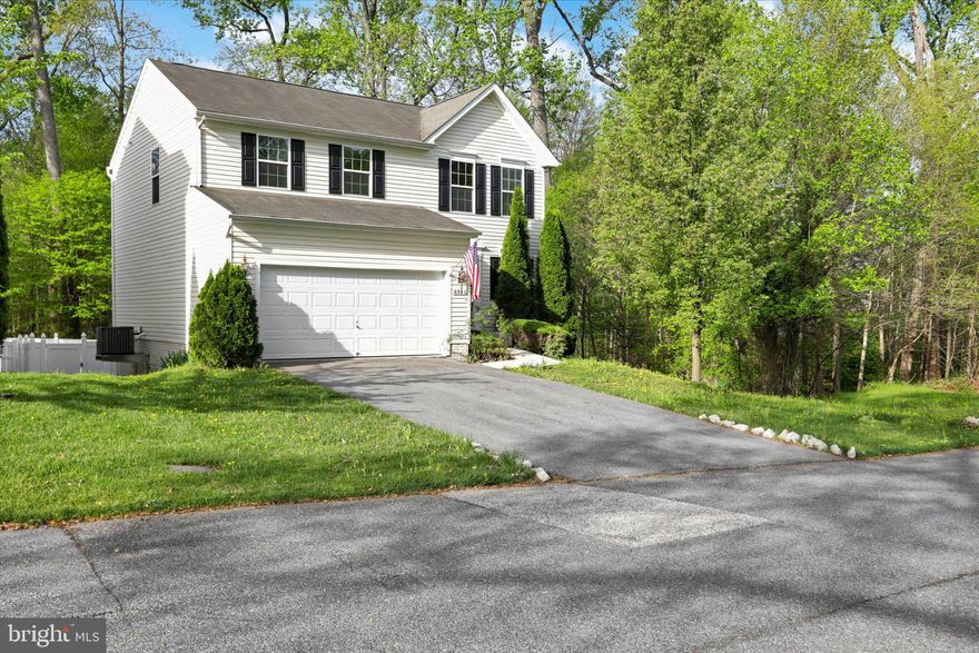 Wonderful colonial with added bonus room conveniently located on a wooded cul-de-sac near major commuter routes and NO CPRA fees.  Open and modern kitchen with quartz counters, tiled backsplash and stainless appliances with built in microwave.  Updated LVL floors and fresh neutral paint highlight the main living space. Like new carpets on the second level. Bonus room leads to a large composite deck overlooking a nice wooded setting while a vinyl 6 foot fence provides privacy and security. Unfinished basement level walks out to rear of home with patrio area.  Traditional lay out with 4 bedrooms and 2 full bathrooms on the second level accessed by a wide staircase.  Large 2 car driveway and garage provide plenty of parking and storage areas.  Unfinished walk-out level basement provides great opportunity  and potential to expand living space.  New HVAC system along with new hot water heater to help with utility costs.  Upgraded washer and dryer also located in basement area.  Popular area close to shopping and major commuter routes.   Showings to start Friday March 27th!