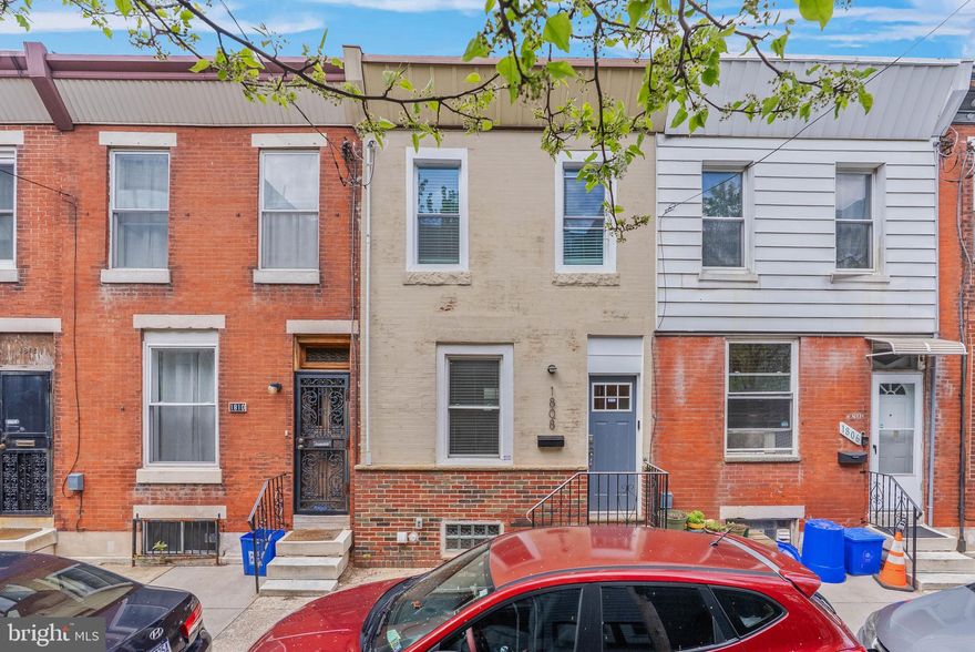 Tucked away on a quiet, tree-lined block just off Broad St in Newbold, you'll find 1808 S Bancroft St. This renovated 2-story home offers 2 bedrooms, 1.5 bathrooms, a private patio, and central a/c. A well-kept brick exterior and a raised entry display charming curb appeal out front. Inside, the bright, open, and airy main level creates a welcoming atmosphere. A tray ceiling frames the living room, where there's plenty of space to hang out, while the dining area can host friends and family. Past a convenient powder room, the gleaming kitchen is fitted with white shaker cabinetry, stainless steel appliances, granite counters, a unique tile backsplash, and a center island with seating. Out back, the rear patio acts as a peaceful escape from the city's hustle, perfect for barbecues, gardening, and al fresco dining. Up on the second level, a sunlit primary bedroom with a ceiling fan and double closets is at the front. A second bedroom and a full bathroom boasting a dual vanity are down the hall. Completing the home is an expansive basement with the laundry and extra storage space. In addition to everything inside, 1808 S Bancroft St's fantastic location earns a Walk Score of 91! Steps away, vibrant E Passyunk Ave and the surrounding blocks are lined with friendly shops, as well as popular restaurants like Ristorante Pesto, Le Virtù, and South Philadelphia Tap Room. Plus, there's easy access to medical centers, public transit, the sports complex, I-76, I-95, and South Jersey. Schedule your tour today!