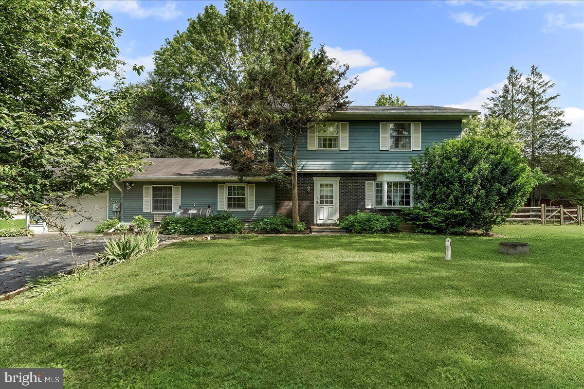 Located in the scenic development of Nottebrae, only minutes to the beautiful fields and trails of Nottingham Park, is a colonial home with a 3.3-acre lot and a 3- stall horse barn featuring a center aisle and tack room. Enter the front door to a hall that opens to a generous sized living room with the elegance of chair rail and a bay window to flood the room with light. Adjoining dining room is perfect for your gatherings big and small. Eat in kitchen features a new spigot, new refrigerator and numerous cabinets. Ceiling fan, chair rail and plate rail add charm and personality. Laundry closet is conveniently located off the kitchen for aid in your chores. Family room, with a brick wood burning fireplace and 2 ceiling fans, is the perfect spot to gather on a cool evening. French door leads to a large office/studio space which is a flexible room for whatever your needs are. Upstairs, the primary bedroom is generous sized with 2 closets, a ceiling fan and its own door to the hall bath. 2 additional bedrooms are easily served by the hall bath, with its own linen closet. Finishing out the first floor is a large 3-season room and powder room, both with easy access from the yard. Enjoy views of your barn and pastures while you relax with a morning cup of coffee or an evening meal! Additional features are central air, one car oversized garage and an open pasture with some wooded area at the back.