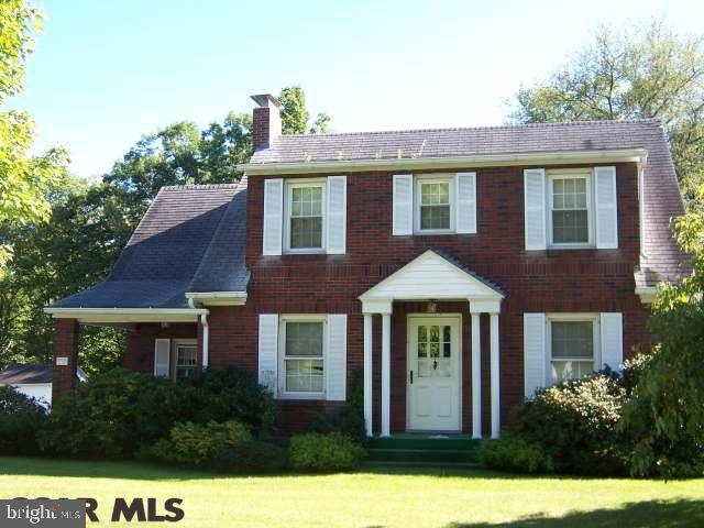 This well built and maintained brick Cape Cod offers classic charm in a comfortable setting. Nestled in the northern part of Tyrone, this home is close to schools, businesses, hospital, and parks. In less than 30 minutes you can be in State College or Altoona while enjoying the benefits of small town living. Inside you have an oversized living room (w/NG fireplace) to relax in after a full meal in the formal dining room, before retiring to the upper floor where you have two spacious bedrooms. The Master bedroom includes a bonus room that could easily be used as a walk-in closet. The natural gas/hot water heating system and central air conditioning provide a comfortable indoor living experience.The large covered patio in the back offers excellent opportunities for outdoor relaxation or entertaining as you listen to the Sinking Run stream flow through your back yard. The full basement has both indoor & outdoor access & has potential for a variety of uses, as the integral 1 car garage