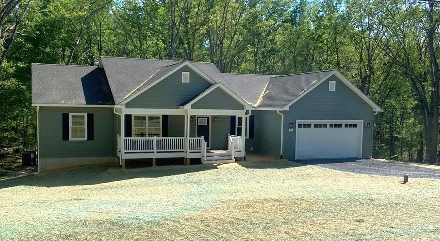Welcome to comfortable country living with modern finishes. This 3 bedroom, 2.5 bath home sits on a 1-acre lot located just 0.1 mile from a state-maintained road. Maintenance-free exterior with Trex decking on the front and back porches. The covered back porch includes two ceiling fans and overlooks a private, tree-lined backyard.

The living room features a cathedral ceiling and electric fireplace with shiplap accent. The kitchen offers stainless steel appliances, an electric double oven range, quartz countertops, soft-close cabinets, and an island for extra seating. The dining area leads out to the covered back porch. The main level features LVP flooring throughout, except for the full hall bath and primary bathroom.

The rear hallway includes a walk-in pantry, half bath, and laundry room with laundry sink. The primary bedroom features a tray ceiling and two walk-in closets. The primary bathroom includes quartz countertops, tile flooring, tiled shower walls, and a private water closet.

The opposite side of the home includes two additional bedrooms, two linen closets, and a full bath with quartz countertop and tile flooring.

The large unfinished walk-out basement offers abundant natural light with multiple windows and doors and includes a rough-in for a future full bathroom, providing plenty of space for expansion.

The attached 2-car garage includes an insulated door, opener with remote, electric vehicle charging outlet, and is fully finished with painted walls and trim for a clean, completed look.

Additional upgrades include Low-E double hung windows, 2x6 exterior walls, and R-21 insulation in the exterior walls.

Enjoy one-level living with room to grow in the basement. Conveniently located near town, Skyline Drive, George Washington National Forest, the Shenandoah River for canoeing, golf courses, and many outdoor recreation opportunities. A home you truly need to see in person to appreciate the quality construction and thoughtful design.