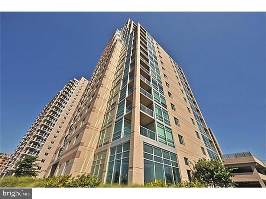Stunning Jr. 2 bedroom or 1 bedroom plus den in the Regatta building at Waterfront Square, a gated community in Northern Liberties.This over sized unit has tons of natural light,a large balcony with views of the Delaware River, hardwood floors, walls of windows, walk in closet, marble bath, and includes parking. Waterfront Square is a 9.5 Acre Gated Community on the Philadelphia Waterfront! This self-contained enclave has its own security, 24 hour manned Guard Gate, onsite Parking and Valet Service. Luxury Amenities Include: A Grand Light House with Magnificent European-Style Spa (offering massages and facials), State-of-the-Art Fitness Center (classes such as Yoga and Pilates 4 days a week), Riverfront Sundeck, and Semi-Olympic (25 Meters) Swimming Pool overlooking the Delaware River and Benjamin Franklin Bridge; Multi-Function room for Meetings, Events, other Functions; Large Landscaped Park, Dog Run, Putting Green, Walking/Jogging Trail; Shuttle Service to Center City (stops from 2nd Street to 30th Street Station), 24 hour Security with closed-circuit television and Access-Controlled Entrance; Personal Touch Extensive Service such as Doorman and Concierge to Arrange for everyday conveniences. Waterfront Square is located in a Premier Location Just Minutes Away from Fine Dining, Quality Shopping and Four Star Entertainment; Convenient to Sport Complexes, I-95, I-676, Atlantic City Expressway, Philadelphia International Airport, and New York/Baltimore/DC.