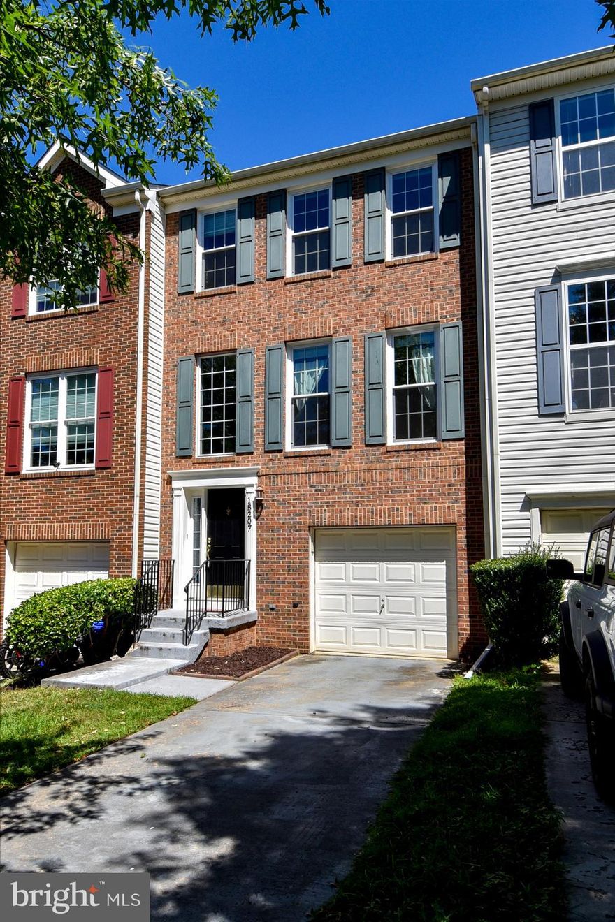 This 3-level townhouse features 3 bedrooms, 2 + 2 bathrooms, finished walkout lower level, 1-car garage & driveway! Hardwood flooring throughout & new laminate flooring in lower level, this house has been freshly painted and ready to move in. Main level has a spacious living/family room, a separate dining area, fully equipped kitchen & island, a powder room, plus walk out to the private deck. Top level has a primary bedroom that comes with a walk-in closet, dual-vanity, shower & tub, along with two other bedrooms and an additional full bath. The lower level is complete with laundry, half bath, a fireplace, walk out to back yard & access to the garage. Located on a private street with guest parking. Available to move in immediately!