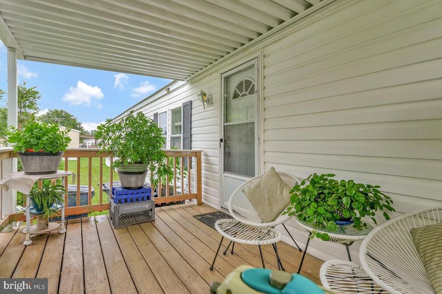 Charming manufactured home in the desirable Flower Village community of Upper Marlboro, MD, offering convenient access to shopping, restaurants, and major highways. This well-maintained, single-level home features 2 bedrooms, 1 full bathroom, a living room with electric fireplace, and a kitchen/EIK with electric range, dishwasher, and refrigerator (no disposal). Luxury vinyl plank flooring flows throughout, and a full-size washer and dryer, central air conditioning, and all-electric utilities provide modern convenience. Enjoy the covered porch and off-street parking for 3 vehicles. The $860/month community fee includes trash, water, common ground maintenance, management and taxes. Flower Village offers a wealth of amenities including paved sidewalks, basketball court, sports field, young children’s playground, onsite management office, off-street and guest parking, fenced yards, storage sheds, cable/internet availability, porches and patios, pet-friendly policies, and energy-efficient all-electric homes. Purchasers must be qualified through Flower Village.