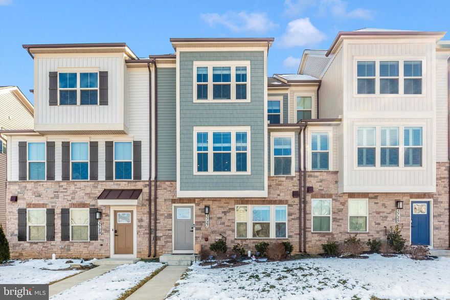 Welcome to this stunning Serenade model home, built in 2022, blending contemporary style and elevated design with everyday comfort across three beautifully finished levels in the highly sought-after Villages of Urbana community. Thoughtfully designed for both entertaining and relaxation, this nearly new home offers the perfect balance of style, functionality, and convenience.

The heart of the home is a beautifully appointed kitchen featuring rich espresso cabinetry, White Frost quartz countertops, a designer ice-tile backsplash, and premium stainless-steel appliances, including a sleek electric cooktop, built-in microwave, and dishwasher. Step outside to the extended covered outdoor deck, creating an ideal space for year-round gatherings and seamless indoor-outdoor living.

Upstairs, three spacious bedrooms provide comfort and flexibility for everyday living, guests, or a home office. The primary suite serves as a private retreat, complete with tray ceilings, recessed LED lighting, a generous walk-in closet, and a spa-inspired ensuite bath featuring double vanities and a walk-in shower designed for comfort and convenience.

Perfectly positioned just across the street from the Stone Barn Recreation Center, community pool, and a fully equipped fitness center, this home offers one of the most desirable locations in the neighborhood. A rear-entry two-car garage with an upgraded EV charging outlet adds modern practicality.

Ideally located just minutes from Urbana Elementary, Middle, and High School, this home provides exceptional everyday convenience. One of the two Goddard Schools located within the Villages of Urbana is also just steps away.

You will enjoy resort-style amenities, including three community pools with a lazy river and slides, tennis courts, walking and biking trails, fitness facilities, and community green spaces, including a community garden. All are just minutes from the Urbana Market District, restaurants, shopping, Downtown Frederick, and convenient commuter access to Montgomery County.