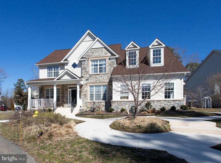 Welcome home to this stunning and spacious residence located in the highly desirable 'ORCHID PARK at Wildewood' community of California, MD, offering over 5,000 square feet of beautifully finished living space across three expansive levels. Featuring 4 bedrooms, 3.5 baths, plus two additional bonus rooms in the fully finished basement, this home provides exceptional flexibility for modern living.

The main level welcomes you with elegant formal living and dining rooms, a large private office ideal for remote work, a convenient half bath, and an inviting family room with a cozy fireplace that flows seamlessly into the gourmet kitchen. The kitchen is thoughtfully designed with granite countertops, stainless steel appliances, ample cabinetry, and a bright eat-in area that opens to a spacious rear deck — perfect for entertaining or relaxing outdoors.

Upstairs, you’ll find four generously sized bedrooms and a convenient upper-level laundry room. The expansive owner’s suite serves as a true retreat, complete with a large sitting area, resort-style en-suite bath, and an impressive walk-in closet.

The fully finished basement offers incredible additional living space, including a large recreation room ideal for a den or media area, two bonus rooms that can function as guest rooms or offices, a full bath, abundant storage, and walk-out access to the backyard.

This home underwent a major renovation in 2017 featuring new flooring throughout, beautiful hardwood floors on the main level, fresh paint, a fully finished basement, and upgraded stainless steel appliances. Additional recent improvements include a new roof and HVAC systems within the past five years, providing peace of mind for years to come.

Residents enjoy access to an amenity-rich community offering pools, a clubhouse, multiple sports courts, scenic bike lanes, and neighborhood recreation areas — all conveniently located just minutes from NAS Patuxent River, shopping, dining, and major commuter routes.

This exceptional home combines space, comfort, and modern updates in a prime location — a must-see!